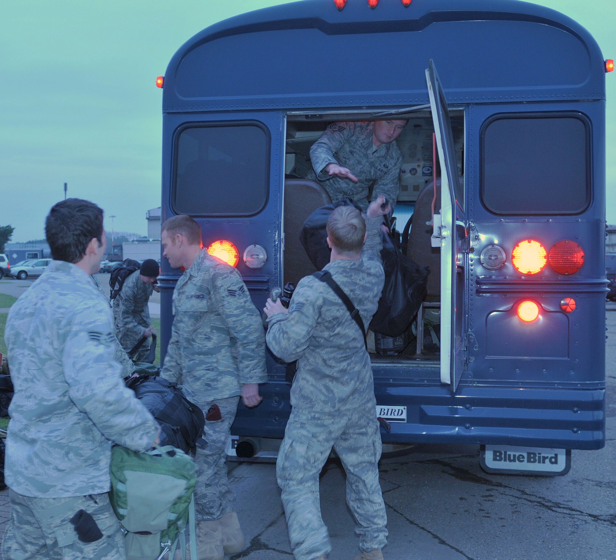 Pararescuemen from the 56th Rescue Squadron load a bus that will drive them to a C-17 Globemaster to deploy from RAF Lakenheath, England, Jan. 4. Pararescue jumpers make up an elite team responsible for combat search and rescue missions. (U.S. Air Force photo by Staff Sgt. Connor Estes)