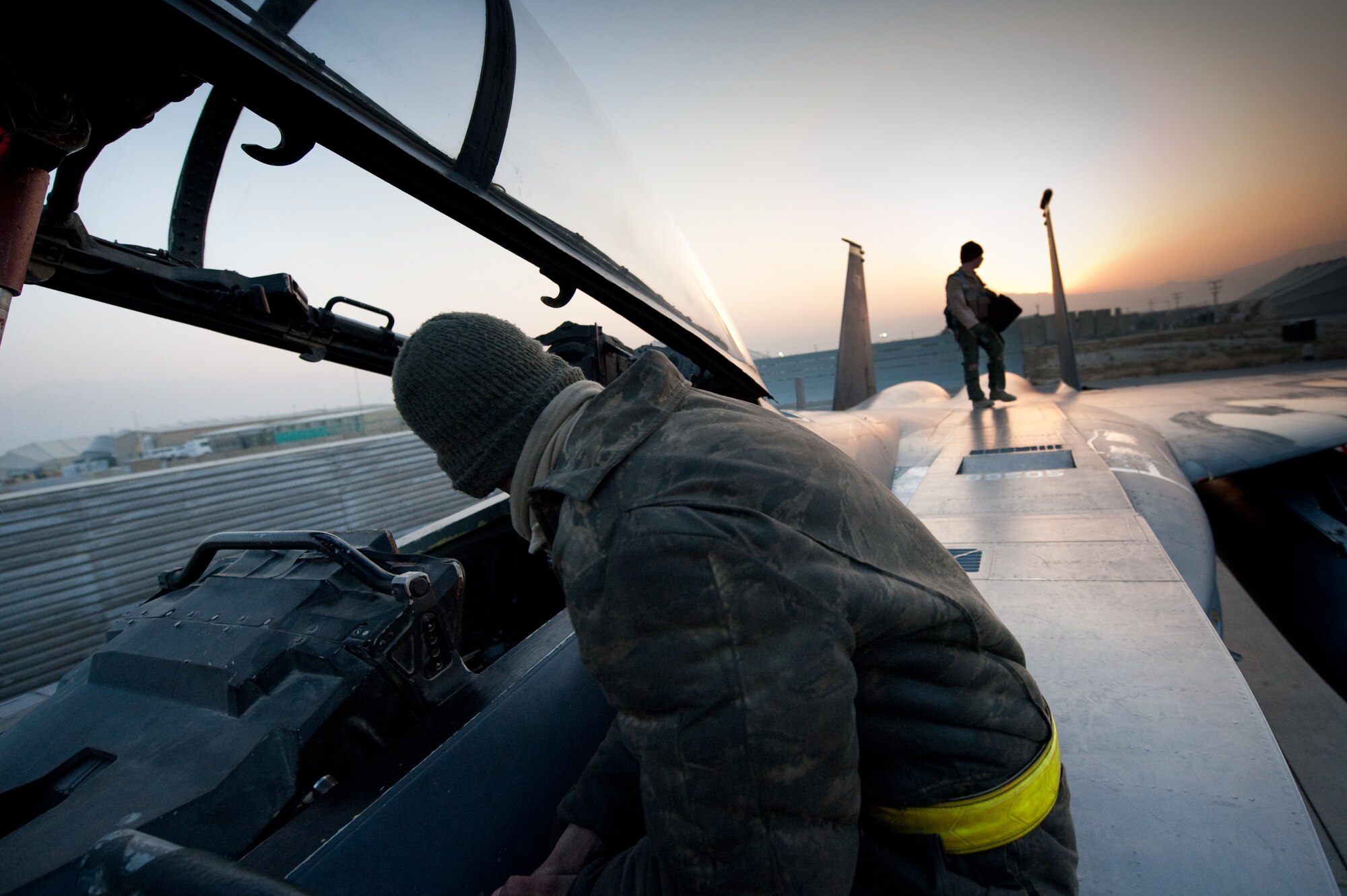 Airman 1st Class Casey Foushee, an F-15 crew chief prepares a F-15E Strike Eagle for take off from Bagram Airfield, Afghanistan, Jan. 4, 2011. Airmen Foushee are both deployed from Seymour Johnson Air Force Base, N.C. (U.S. Air Force by Staff Sgt. Robert Barney)