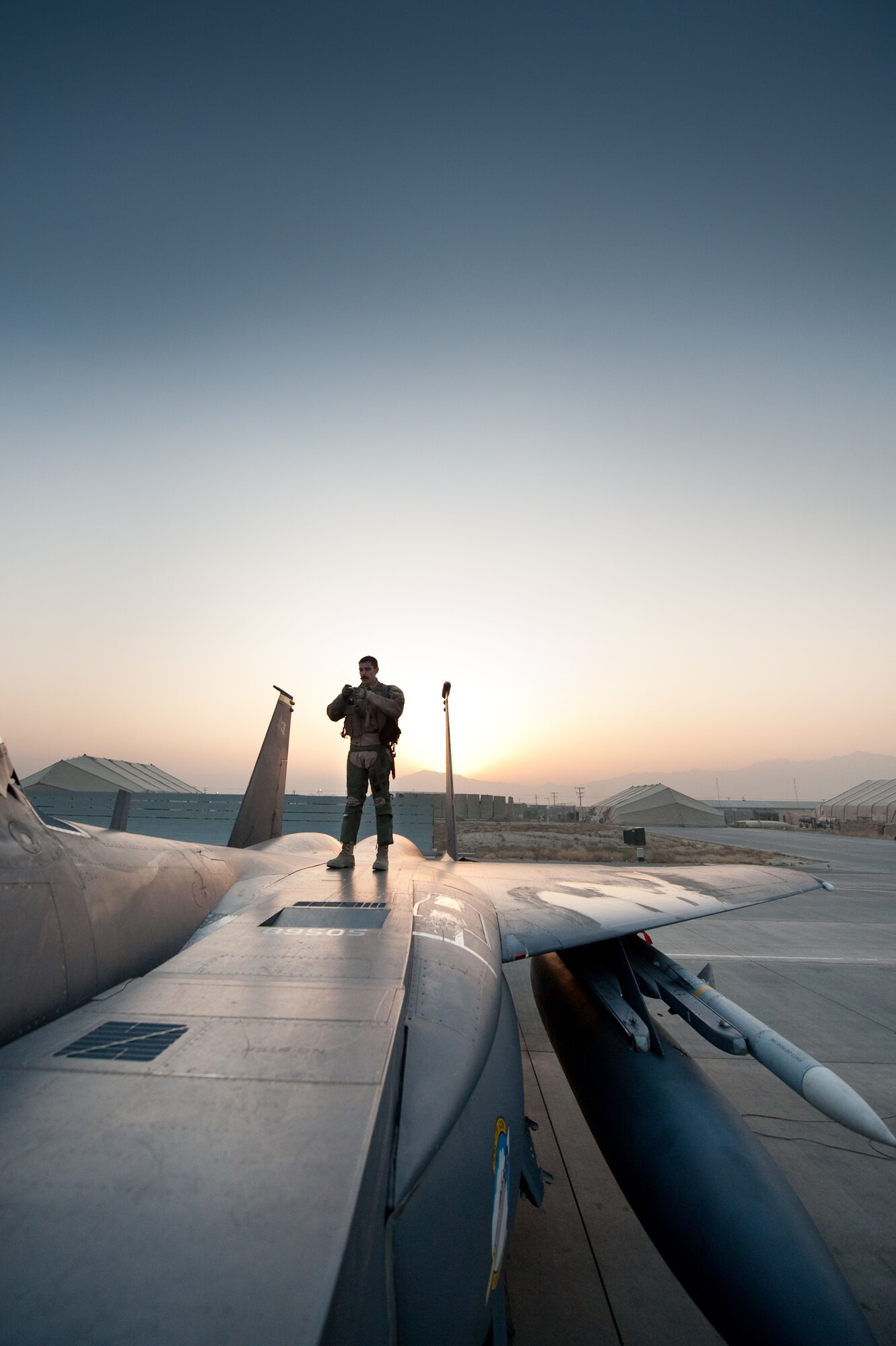 An Airmen with the 336th Expeditionary Fighter Squadron, preforms a preflight inspection of his F-15E, Strike Eagle prior to taking off from Bagram Airfield, Afghanistan, Jan. 4, 2011. The 336th EFS preforms close air support missions within the local area and is deployed from Seymour Johnson Air Force Base, N.C. (U.S. Air Force by Staff Sgt. Robert Barney)