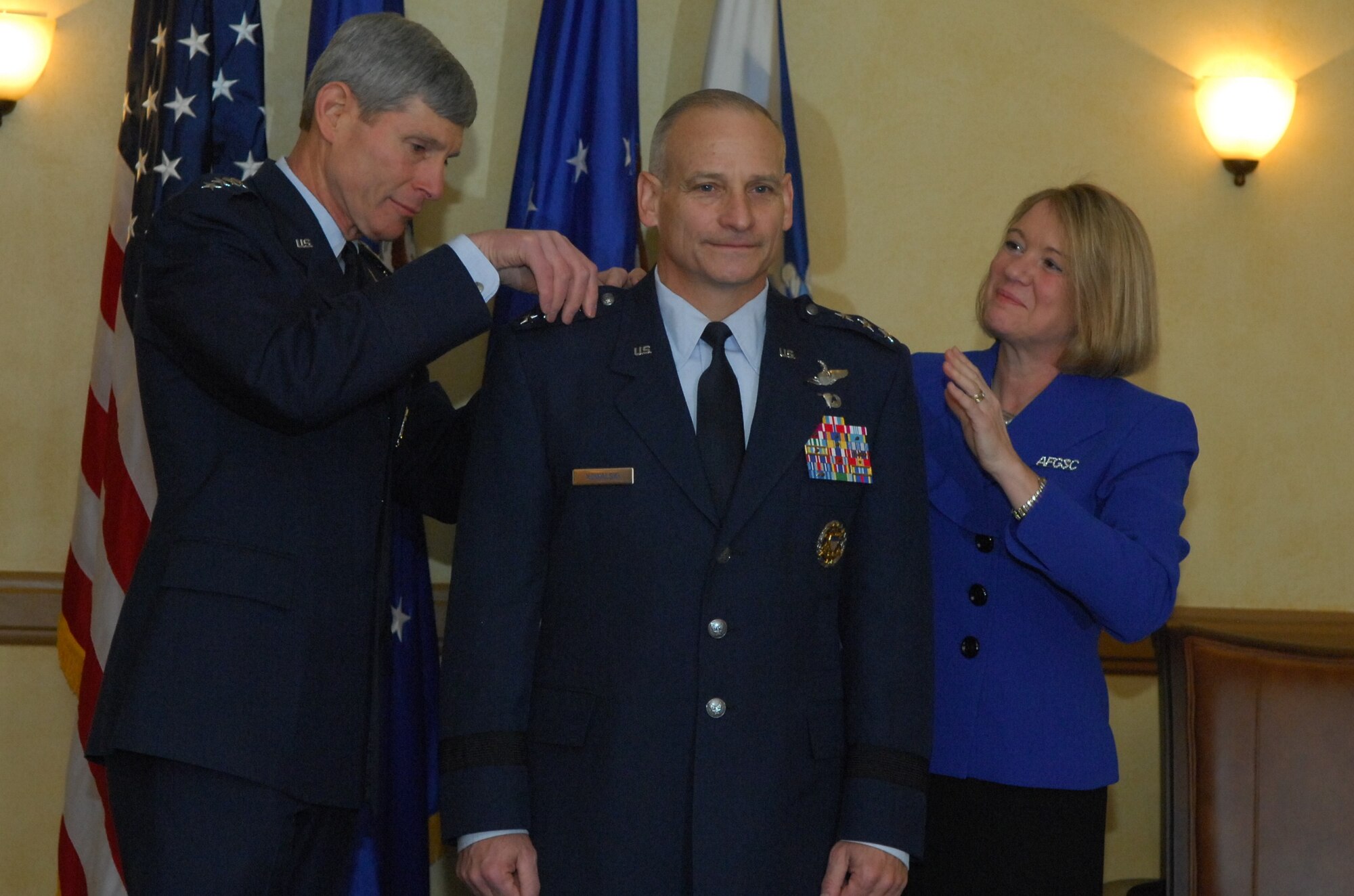 Air Force Chief of Staff Gen. Norton Schwartz and Mrs. Julie Kowalski pin the third star on Lt. Gen. James Kowalski, Jan. 6, 2011, at Barksdale Air Force Base, La.  About an hour later, General Kowalski assumed command of Air Force Global Strike Command, becoming responsible for organizing, training and equipping all U.S. ICBM and nuclear-capable bomber forces.  (U.S. Air Force photo/Master Sgt. Corey Clements)

