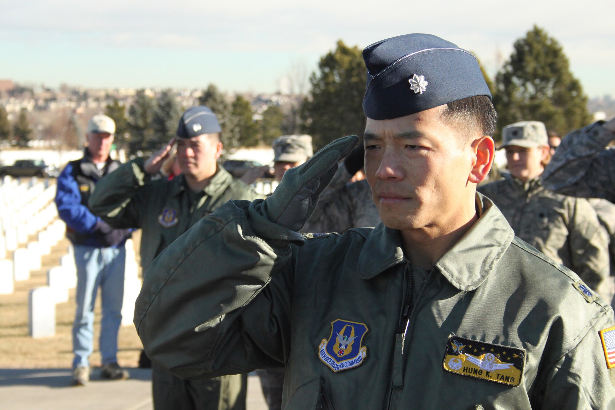 Lt. Col. Hung Tang, commander of the 7th Space Operations Squadron, leads his flight in salute during the Wreaths Across America ceremony Dec. 11, at Fort Logan National Cemetery, near Denver. 2010 was Colonel Tang's third year leading his troops in the ceremony that honors fallen veterans nationwide.