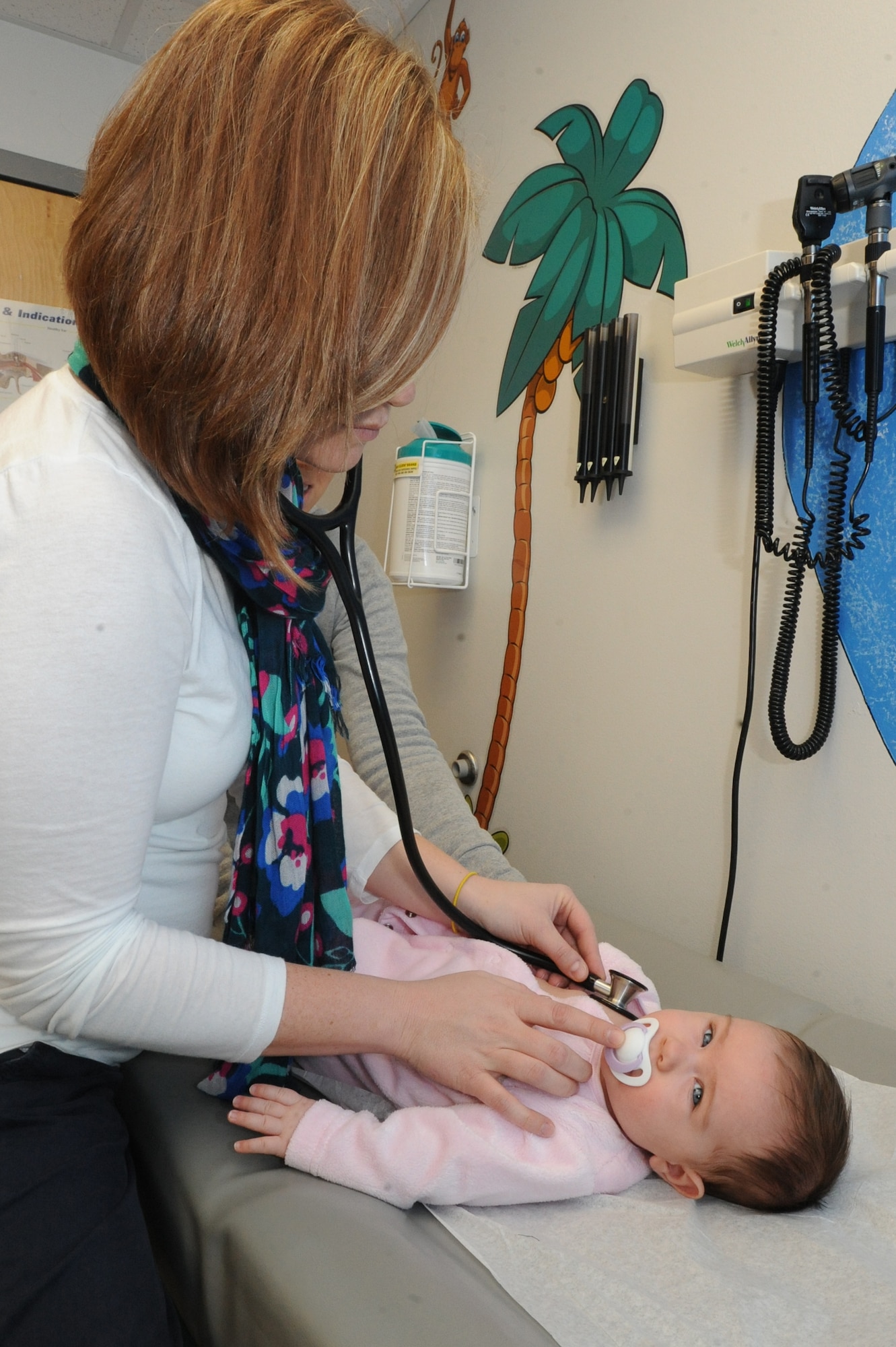 WHITEMAN AIR FORCE BASE, Mo. - Isabella D’Amico, four-month-old daughter of Marie and Tech. Sgt. William D’Amico, 509th Aircraft Maintenance Squadron, receives a check-up from Erin Hartman, 509th Medical Operation Squadron pediatric nurse practitioner Jan. 6. The pediatric clinic closely monitors babies growth to ensure they are healthy. (U.S. Air Force photo by Senior Airman Carlin Leslie)