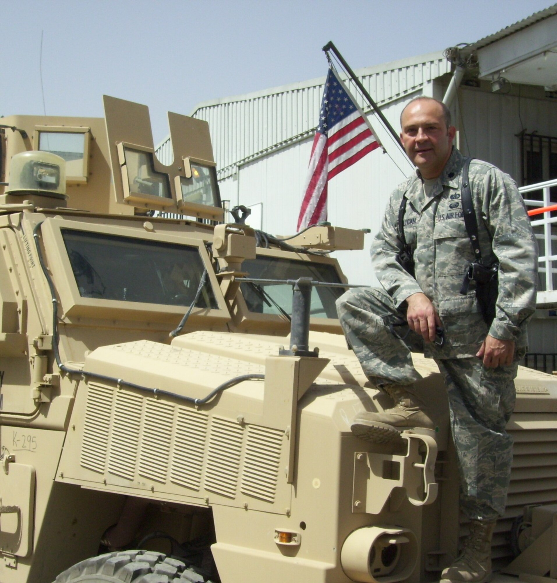 Lt. Col. Tony Millican, 98th Mission Support Group deputy commander, poses with his unit’s newly-arrived, ten-person Mine Resistant Ambush Protected vehicles, which he acquired for his troops during his 2009 deployment in Kabul, Afghanistan.  Due to his outstanding leadership, Colonel Millican has been selected to be one of the four recipients of the 2010 Air Force Lance P. Sijan Award. (Courtesy photo)
