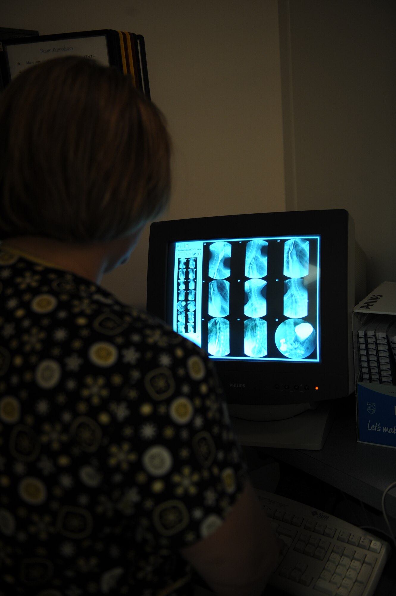 Roberta Gain, 375th Medical Support Squadron Diagnostic Imaging Flight X-ray technologist, reviews the images from a fluoroscopy X-ray Jan. 4, 2011, at the Scott Family Clinic. The 375th Medical Support Squadron Diagnostic Imaging Flight has some of the best and up-to-date technology in the Clinic. (U.S Air Force photo/Staff Sgt. Teresa M. Jennings)