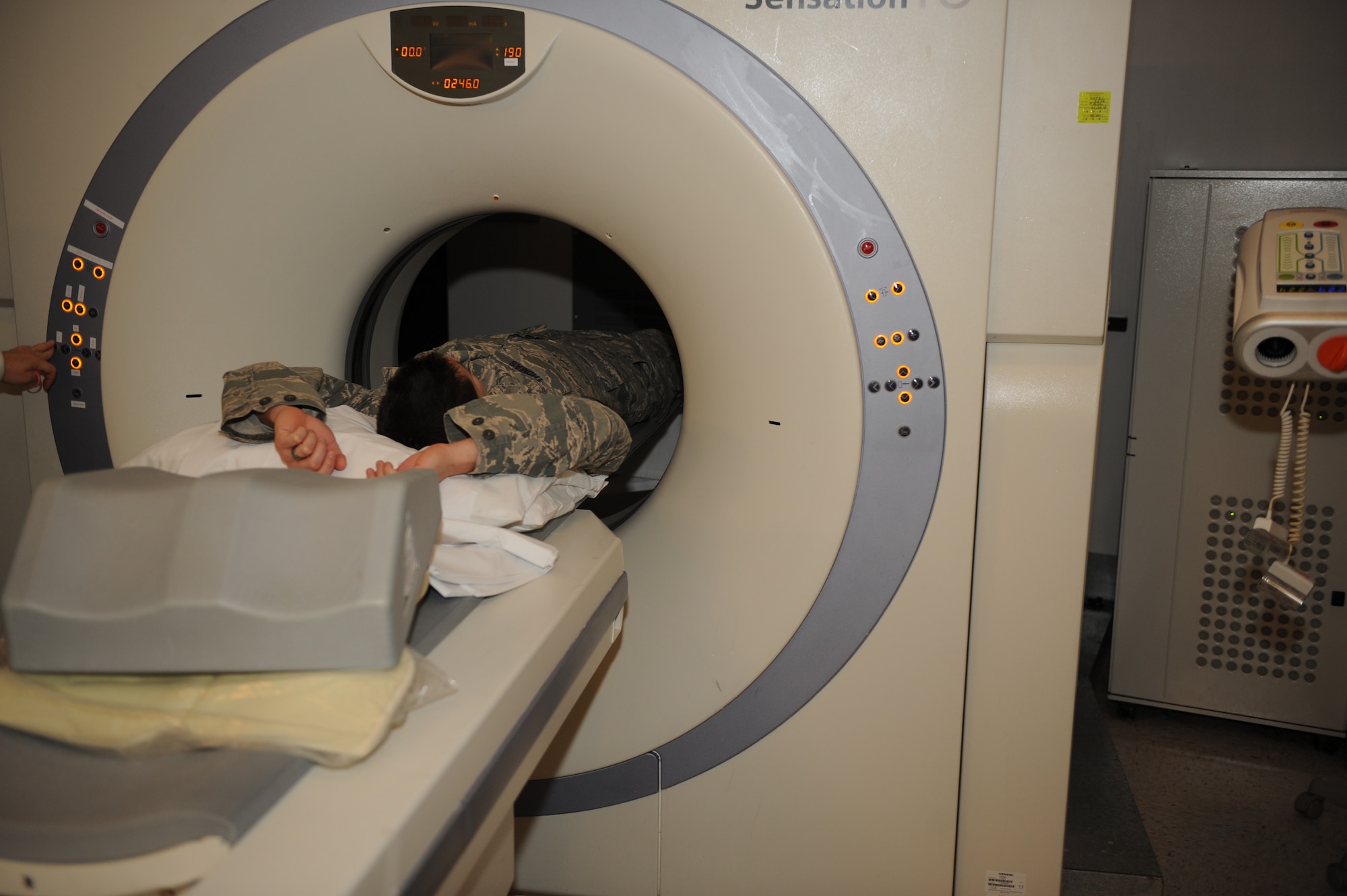 A patient at the 375th Medical Support Squadron Diagnostic Imaging Flight receives a Computerized Axial Tomography scan, otherwise known as a CAT or CT scan. CAT scans are used to create a 3-dimensional picture of any part of the body. (U.S Air Force photo/Staff Sgt. Teresa M. Jennings)