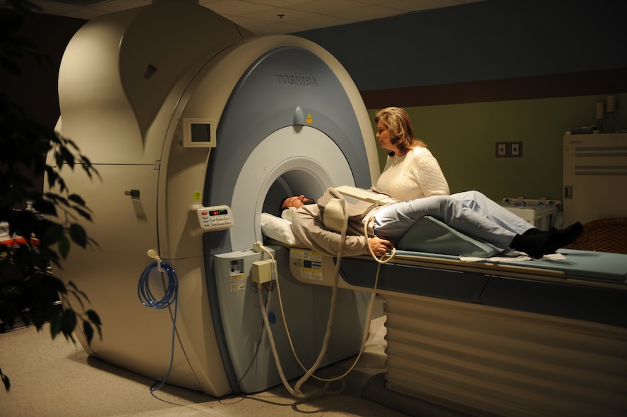 Susan Priebe, 375th Medical Support Squadron Diagnostic Imaging Flight MRI technologist, prepares a patient for an MRI Jan. 4, 2011, at the Scott Family Clinic. The flight offers Magnetic Resonance Imaging (MRI), Nuclear Medicine, Computerized Axial Tomography (CAT or CT scan), ultrasounds and X-rays. (U.S Air Force photo/Staff Sgt. Teresa M. Jennings)