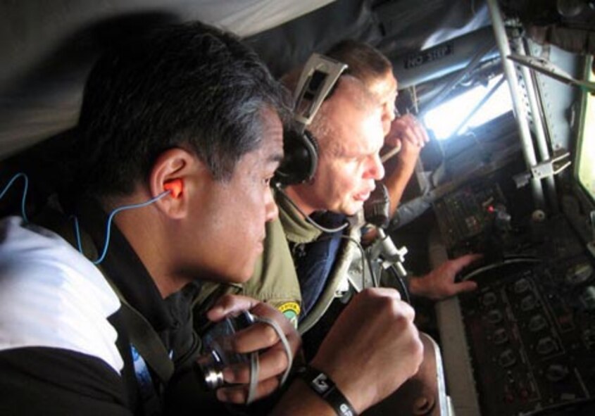 Tech. Sgt. Steve Stanton (center), a boom operator with the 916th Air Refueling Wing, educates employers over the Pacific during an employer appreciation day. (Photo courtesy of ESGR)