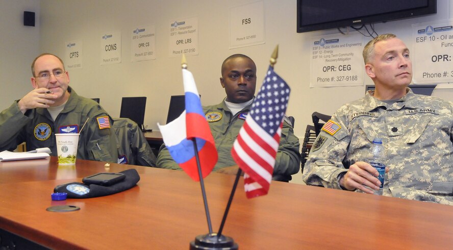 L-R, Lt. Col. Greg Haefele, Maj, Christopher Floyd, and Army LTC Troy Stebbins listen to a mission planning briefing. U. S. Air Force photo by Sue Sapp