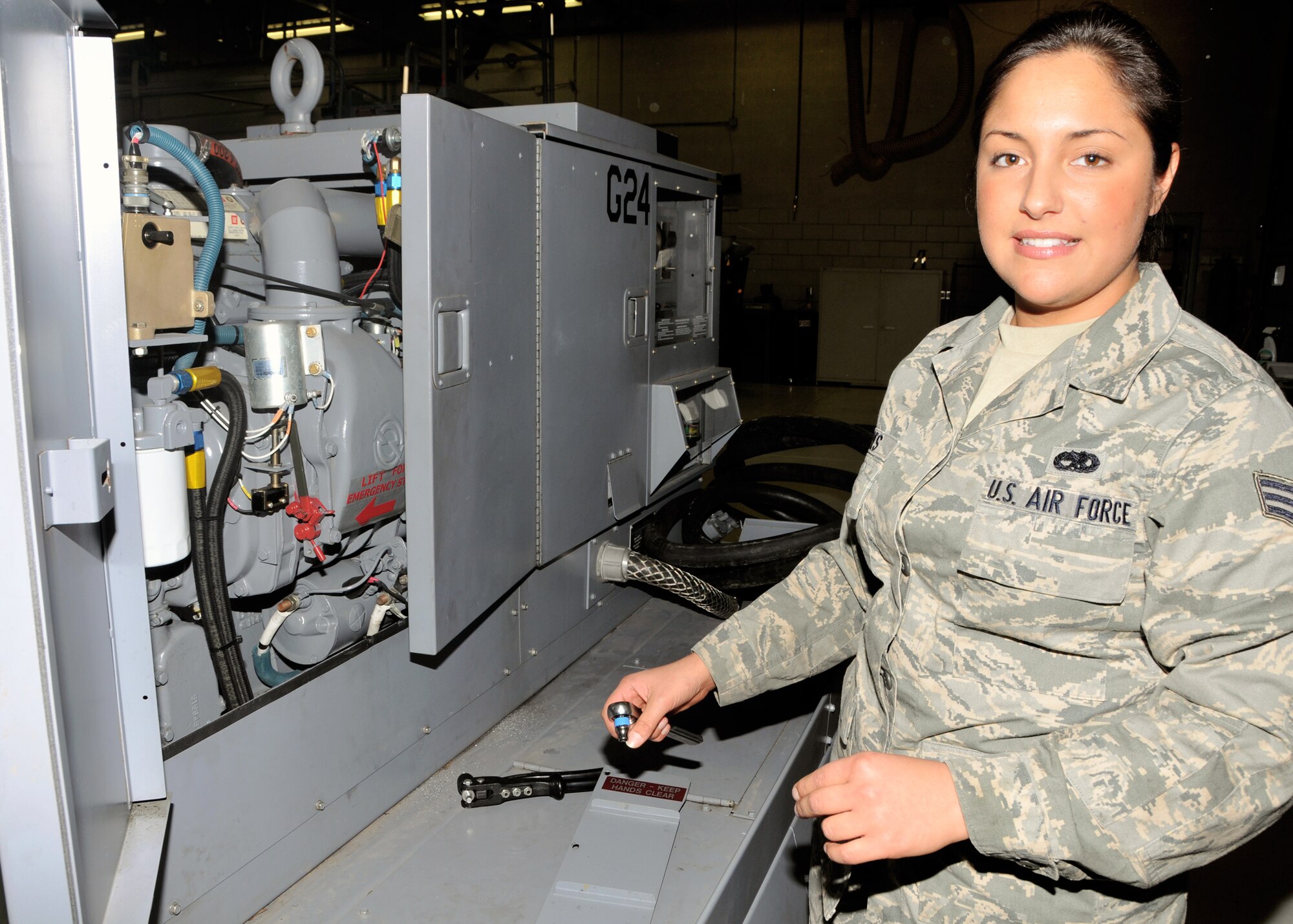 Senior Airman Magdalena Torres, a 914th Maintenance Squadron Aerospace Ground Equipment apparentness, explains the purpose on an aircraft power unit January 6, 2011, Niagara Falls Air Reserve Station, Niagara Falls, NY. Senior Airman Torres was selected to attend the "Leaders Encouraging Airman Development Diversity Visitation Program" at the Air Force Academy in Colorado Springs, Colorado. (U.S. Air Force photo by Staff Sgt. Joseph McKee)