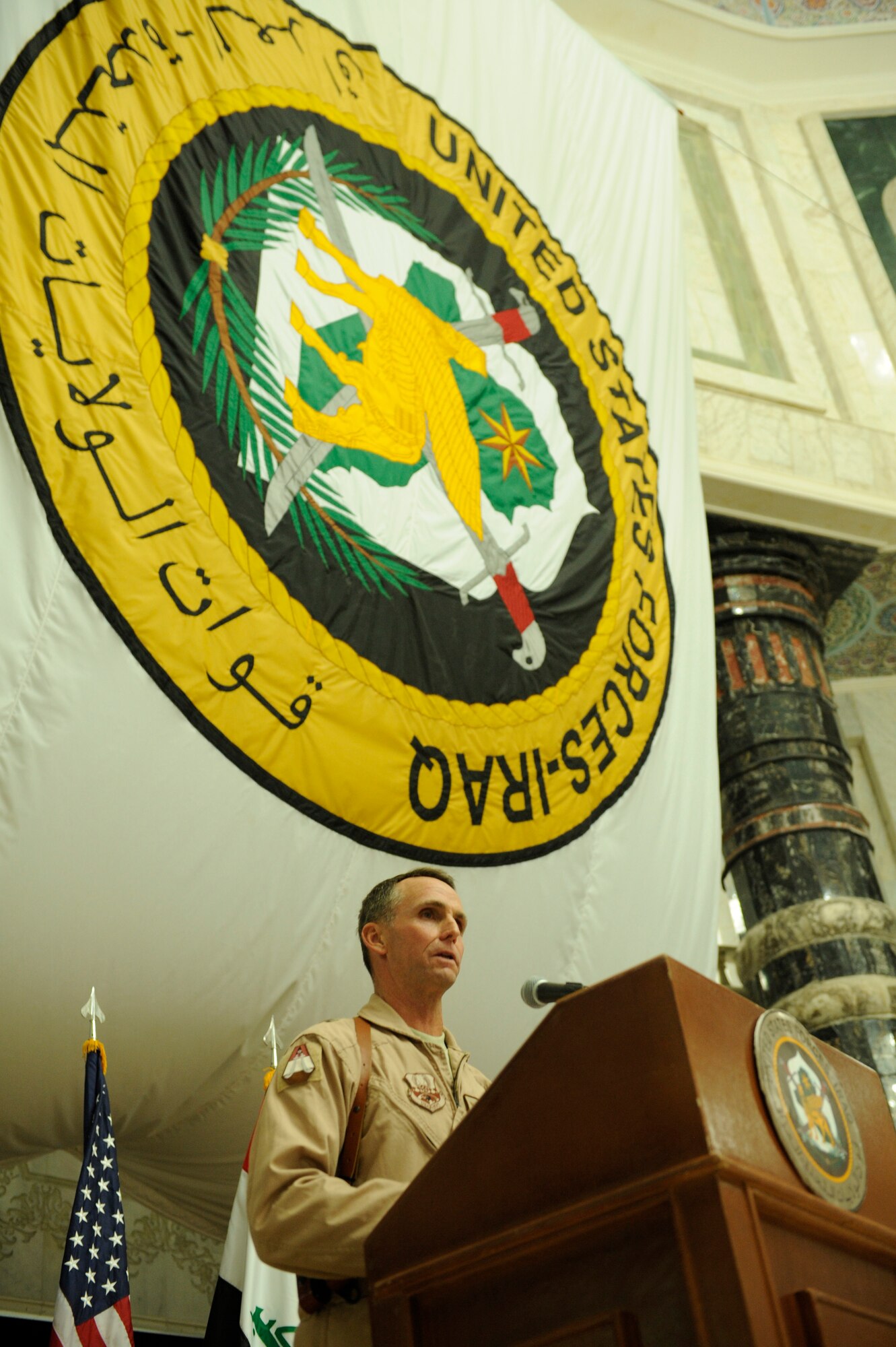 U.S. Air Force Brig. Gen. Anthony Rock, the new 321st Air Expeditionary Wing commander and Director of Iraq Training and Advisory Mission - Air Force, speaks to an audience at his change of command about the coming year under his command at Al Faw Palace in Victory Base Complex, Baghdad, Jan. 6. General Rock most recently served as the Air Command and Staff College commandant and Spaatz Center for Officer Education vice commander. (U.S. Air Force/Staff Sgt. Levi Riendeau)