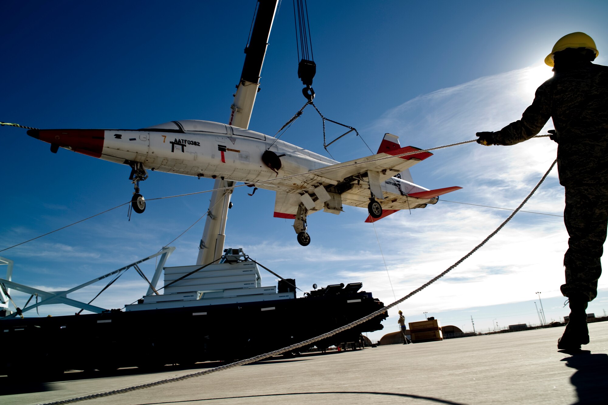 HOLLOMAN AIR FORCE BASE, N.M. -- Staff Sgt. Edward Harris, 49th Aircraft Maintenance Squadron, holds a tether line during the unloading of two T-38 Talons Dec. 14, 2010. The aircraft were transported here using NASA's Super Guppy aircraft and are the first two of 15 to be shipped here. The U.S. aircraft were used by the Republic of South Korea for training up until a few years ago and will now be regenerated and used as fifth generation fighter support. Holloman will regenerate the T-38s before they are sent to Joint Base Langley-Eustis, Va. and Tyndall AFB, Fla. (U.S. Air Force photo by Airman 1st Class Joshua Turner/Released)