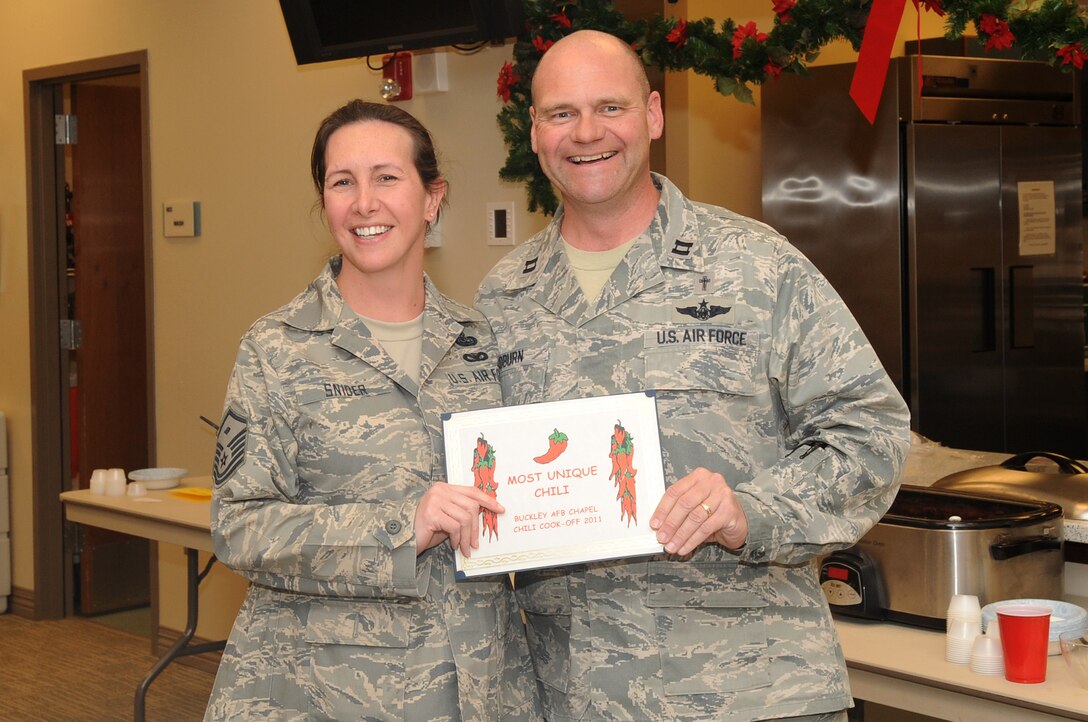 BUCKLEY AIR FORCE BASE, Colo.-- 460th Space Wing Security Forces Squadron First Sgt., Master Sgt. Deanna Snider wins an award for Most Unique Chili at the annual chili cook-off, Jan. 5, 2011. Each winner won a  congratulatory certificate and a twenty-five dollar gift card. (U.S. Air Force photo by Airman Manisha Vasquez) 