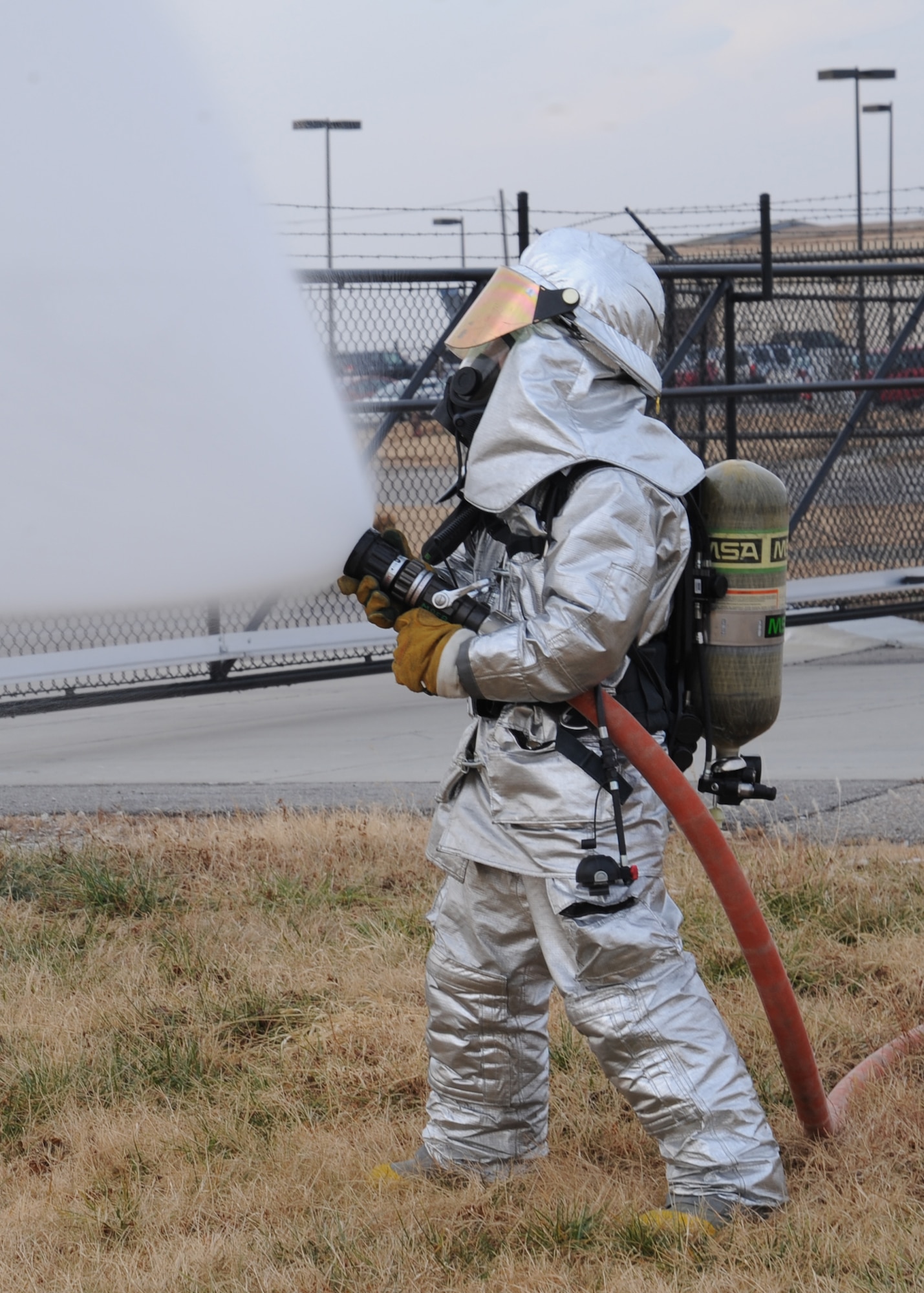 Airman 1st Class Ryan Jordan, 22nd Civil Engineer Squadron firefighter, tests different fire hose pressures Dec. 21 2010, McConnell Air Force Base, Kan. Operational tests are performed daily at the beginning of each shift to ensure the gear is effective. Military firefighters perform rescue and firefighting operations during structural fires, aircraft crash incidents, vehicle emergencies and natural cover fires. The firefighters also assist with fires in the local community if needed. (U.S. Air Force Photo/Airman 1st Class Katrina M Brisbin)