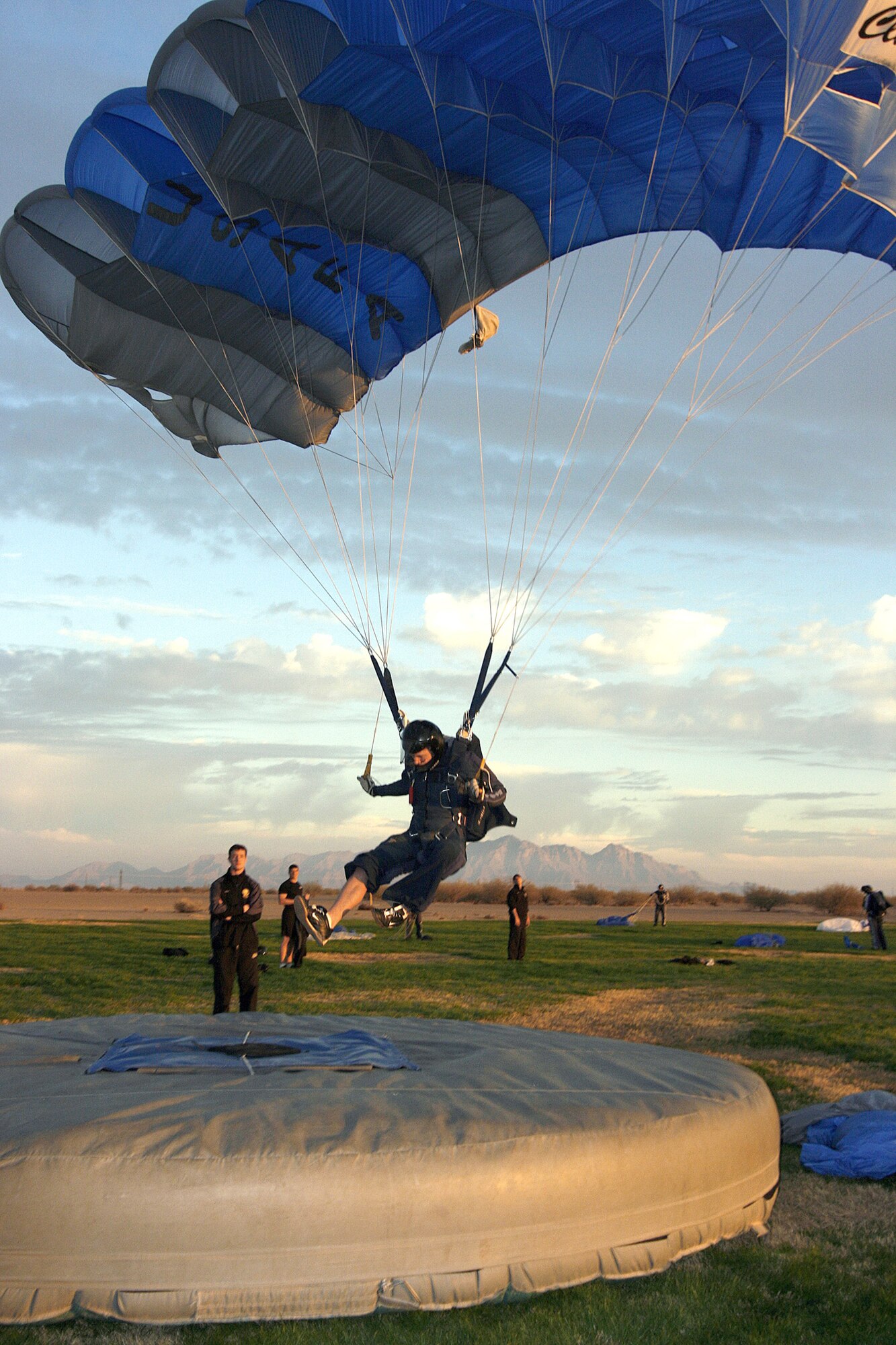 Cadet 1st Class Josh LeMair, a member of the Air Force Wings of Blue Parachute Competition Team, nails a classic accuracy jump in the U.S. Parachute Association's National Collegiate Parachuting Championships, held Dec. 30, 2010, to Jan. 1, 2011, in Eloy, Ariz., from. Wings of Blue teams won gold in four-way open formation skydiving, two-way vertical formation skydiving, intermediate and masters sport accuracy, intermediate and masters classic accuracy and team classic accuracy. (Courtesy photo/Niklas Daniel)