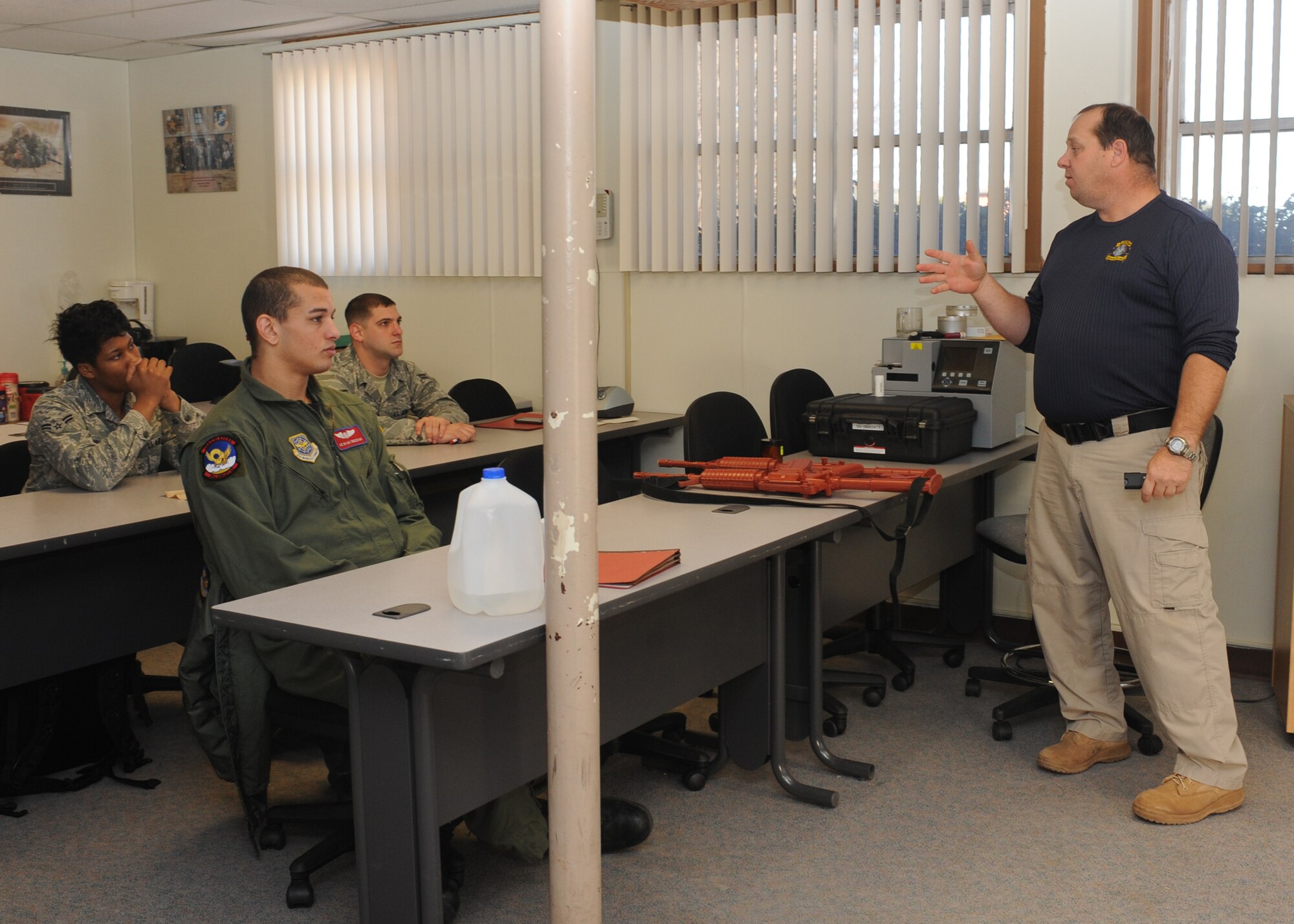 DYESS AIR FORCE BASE, Texas – Glenn Mitchell, 7th Security Forces Squadron trainer, teaches members of the 317th Airlift Group challenge procedures Jan. 5 during a security forces augmentee course held at the 7 SFS training building here. Members of the 317 AG are trained to be 7 SFS augmentees to provide additional installation security. (U.S. Air Force photo/Senior Airman Jenifer H. Calhoun)
