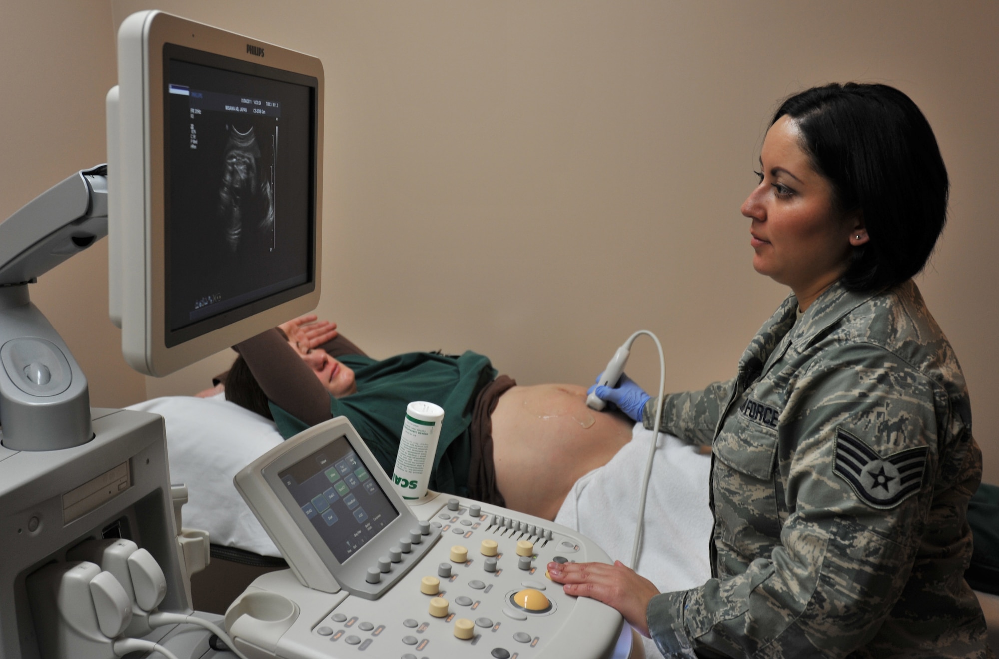 U.S. Air Force Staff Sgt. Amanda Munoz, 35th Surgical Operations Squadron ultrasound technologist, performs an obstetric ultrasound Jan. 4, 2010; Misawa Air Base, Japan. This form of sonography is used to visualize the baby in its mother’s womb. Sergeant Munoz is one of two ultrasound technologists at Misawa Air Base. (U.S. Air Force photo by Airman James B. Bauer/Released)