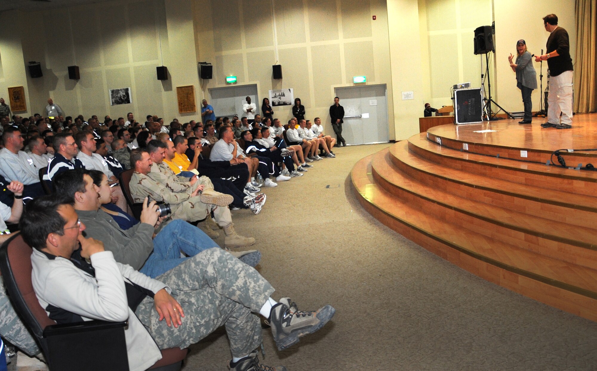 SOUTHWEST ASIA -- Service members gather at the base theater for a comedy show by Stars For Stripes Jan. 1. (U.S. Air Force photo by Senior Airman Cynthia Spalding)