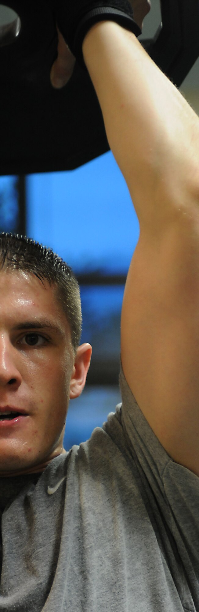 Senior Airman Aaron Cysensky, 31st Communications Squadron, lifts weights at the Dragon Fitness Center Aug. 17.  Remaining in good physical shape is not only important for one’s body, it is also essential to military readiness. (Air Force photo by Airman 1st Class Katherine Windish)