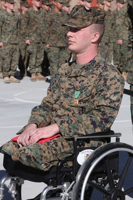 Corporal Jonathan Dowdell received the  Navy Marine Corps Achievement  Medal with Combat distinguishing Device in front of his former unit, Company K, 3rd Battalion, 7th Marine Regiment, Jan. 7, 2011.