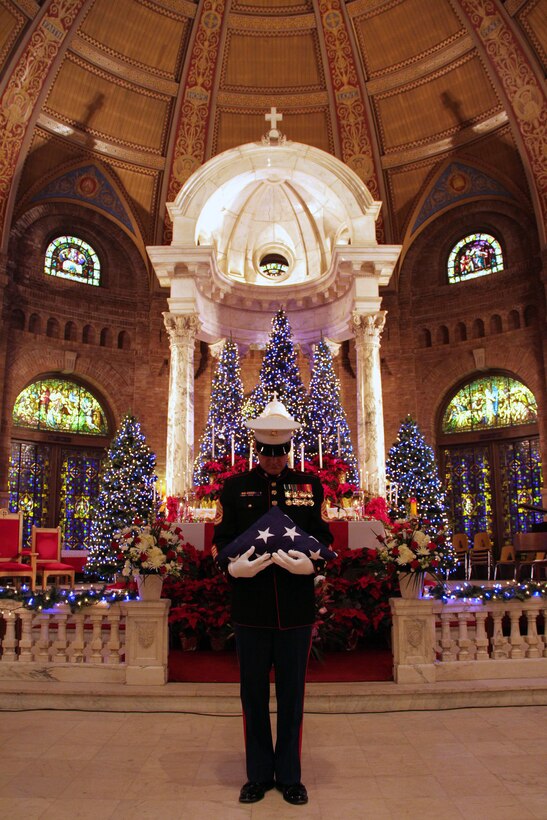 Gunnery Sgt. Michael Soucy honors Korean War veteran Sgt. Douglas B. Michaud during a memorial mass at the Incarnation Catholic Church Jan. 7. Soucy, 38, from Biddeford, Maine, is the Recruiting Substation Bloomington staff noncommissioned-officer-in-charge. Michaud, one of the "Chosin Few," passed away on Dec. 8, 2010. For more photos of the event, visit the Recruiting Station Twin Cities fan page at www.facebook.com/rstwincities.
