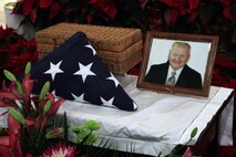 A flower arrangement, American flag and family photo lie next to the ashes of Korean War veteran Sgt. Douglas B. Michaud during a memorial mass at the Incarnation Catholic Church Jan. 7. Michaud, one of the "Chosin Few" who fought through 10 Chinese infantry divisions at the Chosin Reservoir in 1950, passed away on Dec. 8, 2010. For more photos of the event, visit the Recruiting Station Twin Cities fan page at www.facebook.com/rstwincities.