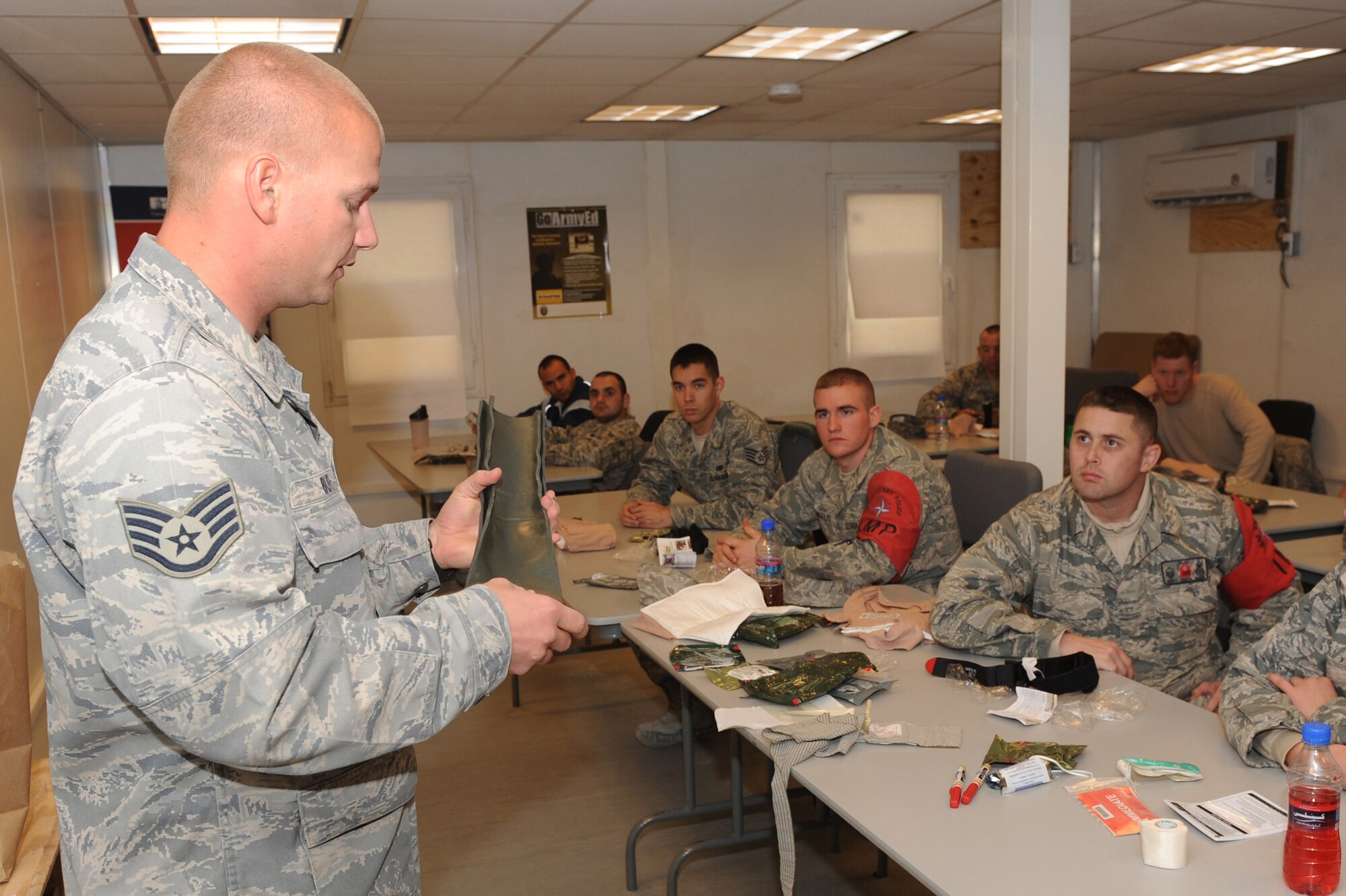 Staff Sgt. Matt Blitz explains how to care for broken limbs using a splint Jan. 3, 2011, at Kandahar Airfield, Afghanistan. Sergeant Blitz provided refresher training to International Security Assistance Force Military Police members on combat casualty response kits that will be readily available in base patrol vehicles. Sergeant Blitz, from Spangdahlem Air Base, Germany, is an independent duty medical technician assigned to the 73rd Expeditionary Air Control Squadron. (U.S. Air Force photo by Tech. Sgt. Chad Chisholm/Released)