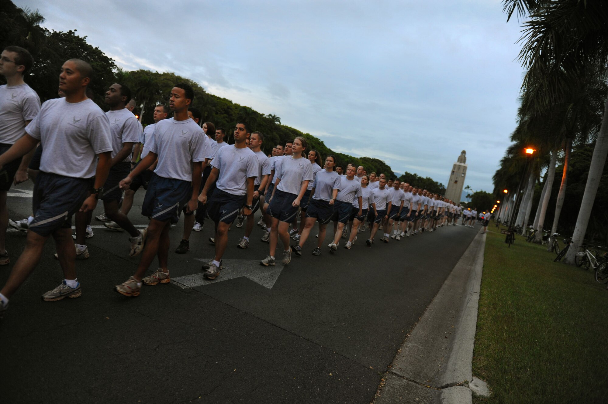 Airmen and Sailors begin the Warrior Run Jan. 7 outside the 15th Wing Headquarters Building at Joint Base Pearl Harbor-Hickam, Hawaii.  Nearly 1,100 participants ran the approximately two-mile course. (U.S. Air Force photo/Airman 1st Class Lauren Main)