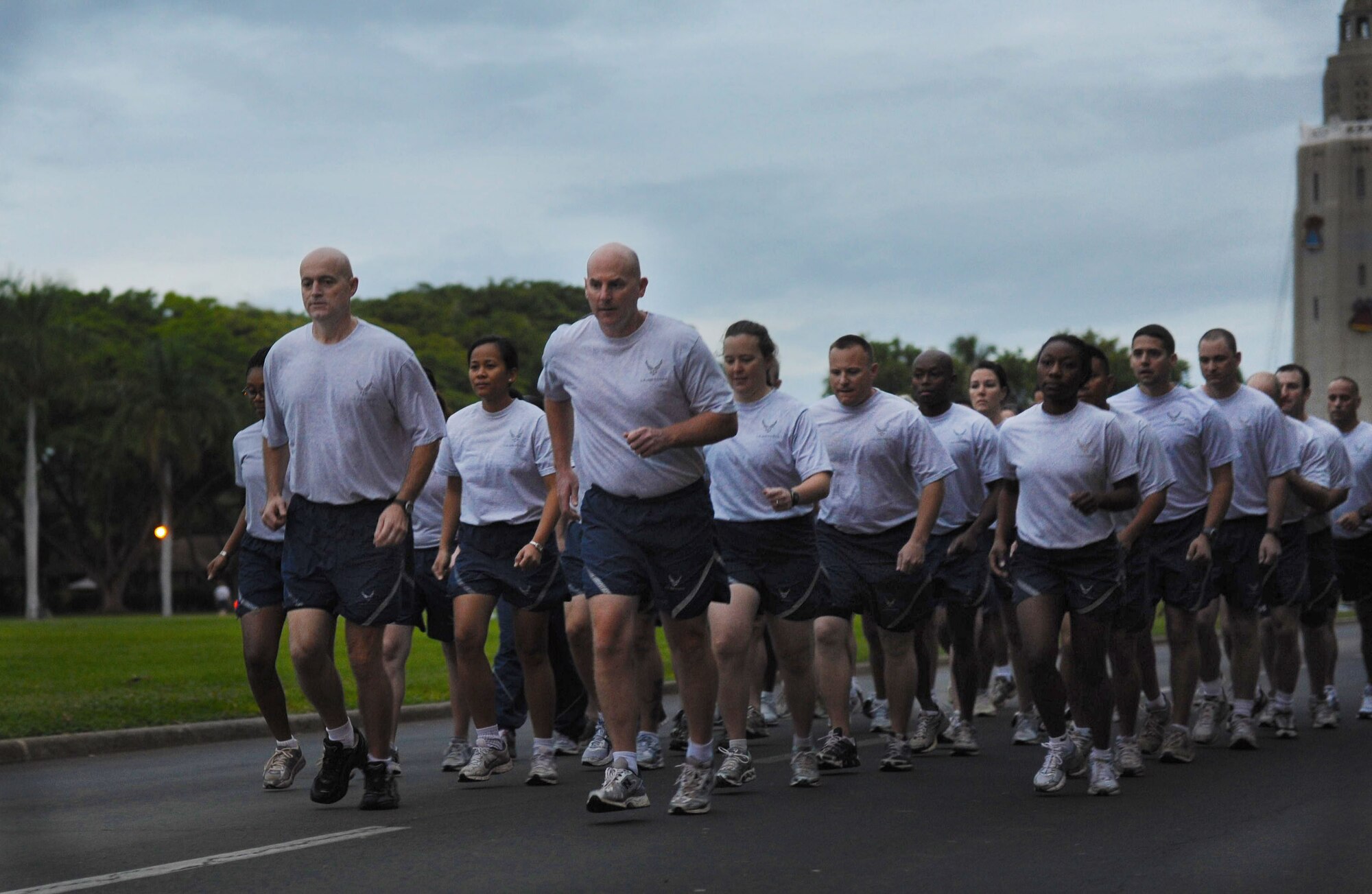 The 15th Wing formation led by (left to right) Chief Master Sgt. Craig Recker, 15th Wing command chief and Col. Sam Barrett, 15th Wing commander, takes off as the first Warrior Run of 2011 begins Jan. 7 at Joint Base Pearl Harbor-Hickam, Hawaii. Nearly 1,100 participants ran the approximately two-mile course. (U.S. Air Force photo/Airman 1st Class Lauren Main)