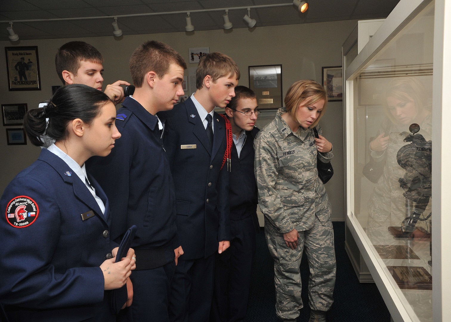 First Lieutenant Kathleen Hensley (right), 59th Medical Support Squadron, and a group of Junior ROTC cadets from Coldspring-Oakhurst High School visit the Air Force Security Forces Museum during a tour of Lackland Dec. 3. Lieutenant Hensley is a volunteer escort with the base tour program. (U.S. Air Force photo/Alan Boedeker)
