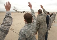 Leaders from Joint Base San Antonio wave goodbye as a plane carrying Airmen deploying in support of Operation New Dawn departs Lackland's Kelly Field Annex flightline Jan. 3. Airmen from Lackland and Randolph AFBs are among nearly 130 Airmen deploying to Kuwait, Qatar and additional locations in Southwest Asia. (U.S. Air Force photo/Robbin Cresswell)