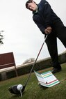 Brandon Ellis readies his club behind the golf ball that helped him to a 62-stroke round at the Gateway Hills Golf Course. (U.S. Air Force photo/Robbin Cresswell)