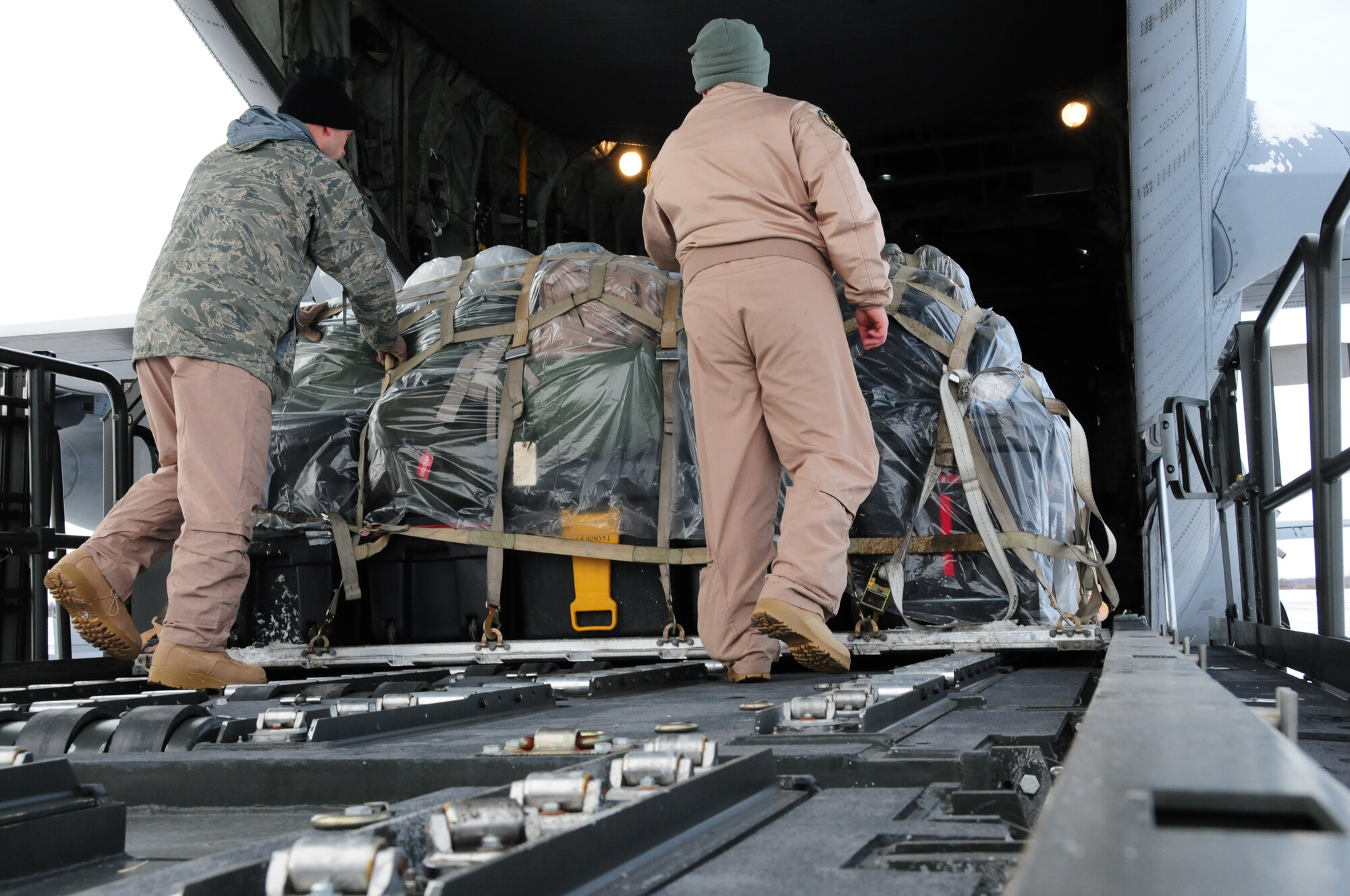 NIAGARA FALLS AIR RESERVE STATION, N.Y-Crews load up a C-130 with equipment and supplies as members of the 914th Airlift Wing prepare to deploy again to the AOR. The deployment will take place over the next few days.  Members of the 914th AW have repeatedly supported operations in Southwest Asia since 2001.  (U.S. Air Force Reserve photo by Mr. Peter Borys)