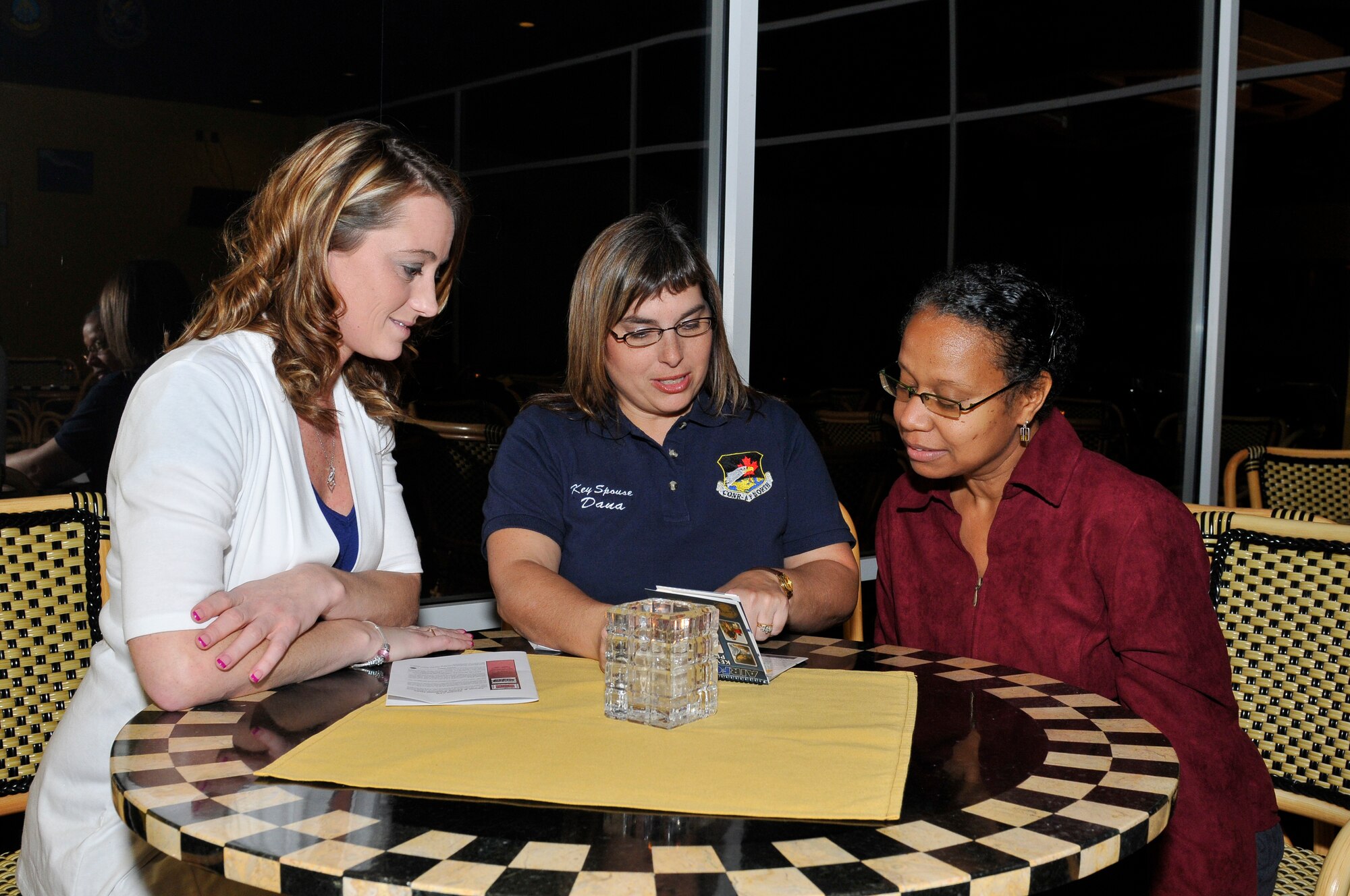 Air Forces Northern Key Spouse Dana Fredrickson (center), discusses
AFNORTH's new Key Spouse Program with Tasha Cervantes (left) and Joyce
Melton, at the kick-off celebration Thursday evening at Tyndall AFB's
Heritage Club. The event introduced the program to AFNORTH spouses and
family members and featured AFNORTH senior leadership guest speakers. The
program was established to offer a venue for social activities, assistance
and information about available resources throughout the area. Now
officially established, the Key Spouses said they will be seeking to host
activities throughout the year to promote the program and its activities.
(U.S. Air Force photo by Lisa Norman)

