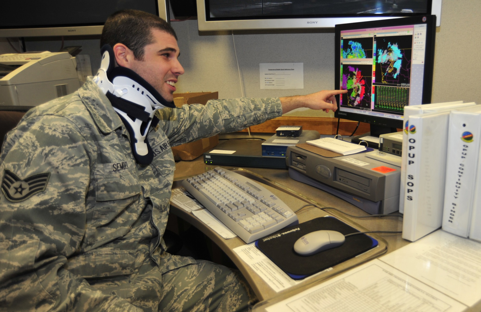 Senior Airman Matthew Semder, 62nd Operations Support Squadron weather technician, reviews local weather conditions Jan. 5 at McChord Field, Joint Base Lewis-McChord, Wash. According to Airman Semder, the weather technicians monitor local wind speed, wind direction, sky condition and temperature. (U.S. Air Force photo/Airman Leah Young)