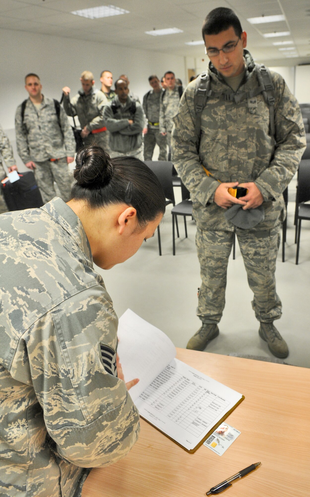 SPANGDAHLEM AIR BASE, Germany – Staff Sgt. Rebecca Tenoue, 52nd Logistics Readiness Squadron passenger manifester, processes and weighs Senior Airman Marcus Irizarry, 480th Aircraft Maintenance Unit weapons journeyman, in the 52nd Logistics Readiness Squadron building Jan. 7. Members from the 480th AMU are being flown to Nellis Air Force Base, Nev., to provide maintenance for deploying F-16 Fighting Falcons that are participating in Red Flag Jan. 22 – Feb.  4. (U.S. Air Force photo/Senior Airman Nick Wilson)