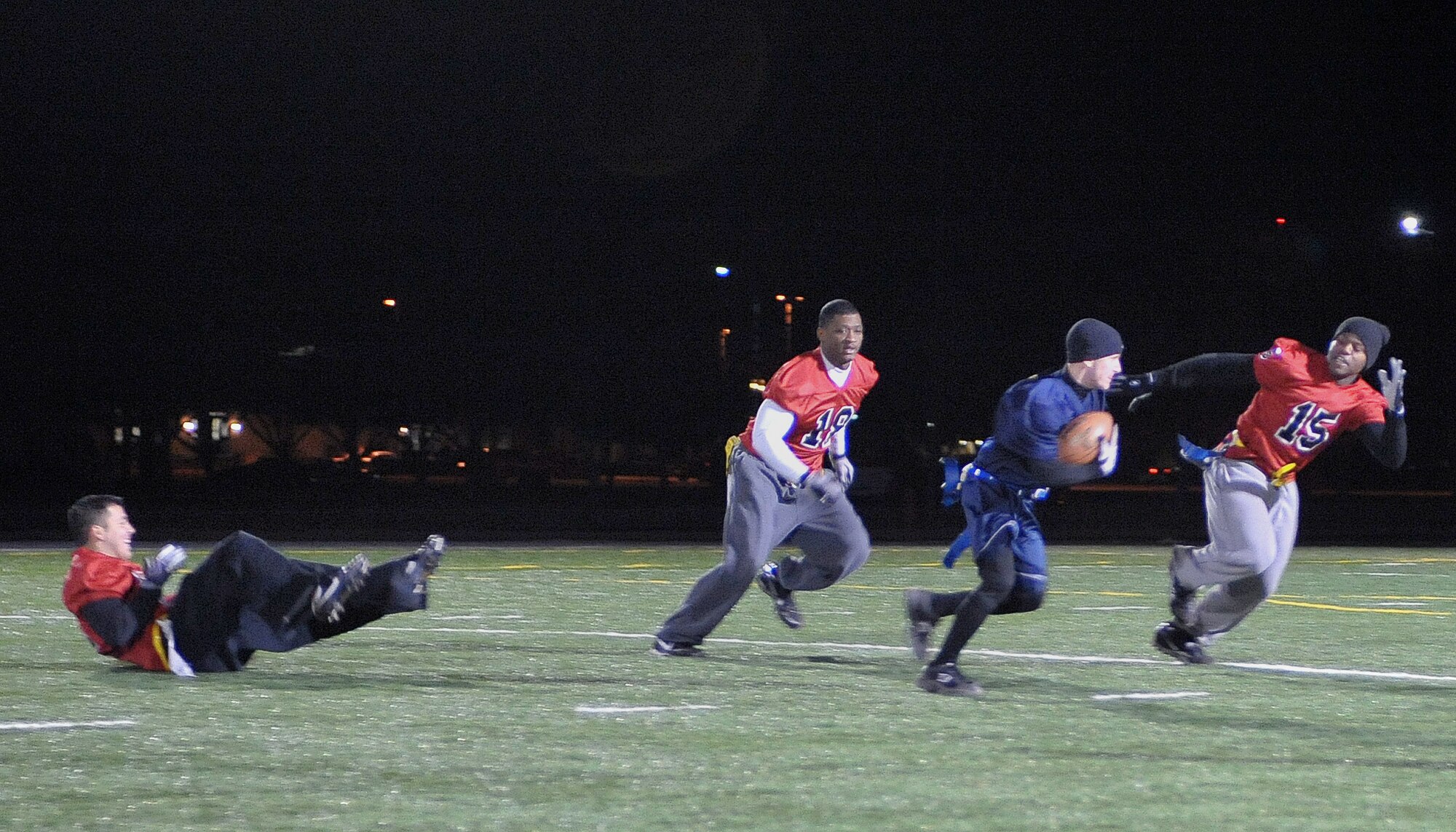David Mayerck, 27th Special Operations Security Forces Squadron, rushes to the goal-line at the base track and football field Jan. 6, during the championship game against the 27th Special Operations Civil Engineer Squadron.  The championship trophy remained with 27 SOCES as they won the title for the fourth straight year with a 41-33 victory over 27 SOSFS. (U.S. Air Force photo by Senior Airman James Bell)