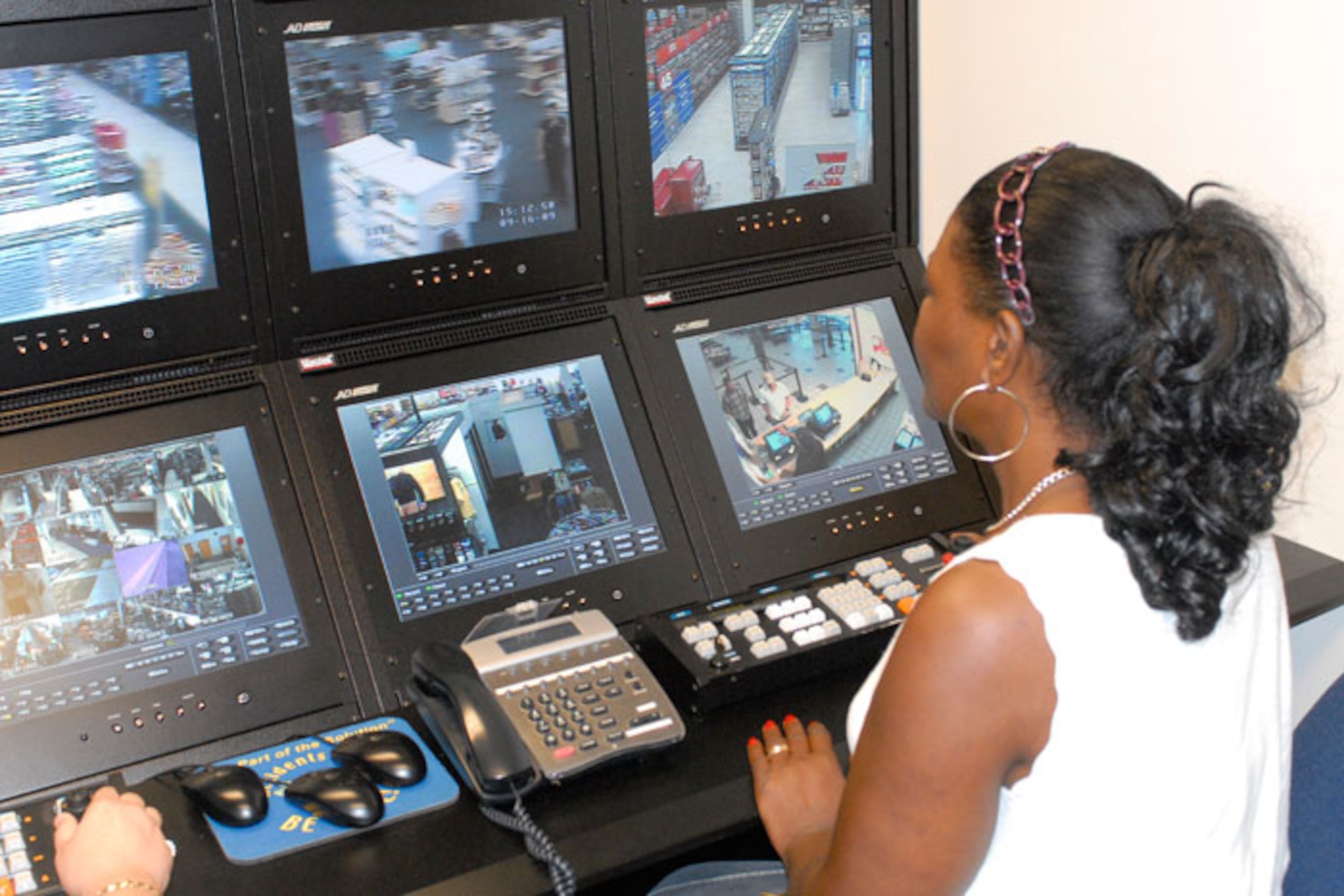 Patricia Maynor, a loss prevention specialist at Fort Benning, Ga., scans the store Sept. 16, 2010 from an electronic video surveillance room. (U.S. Army photo\Vince Little)