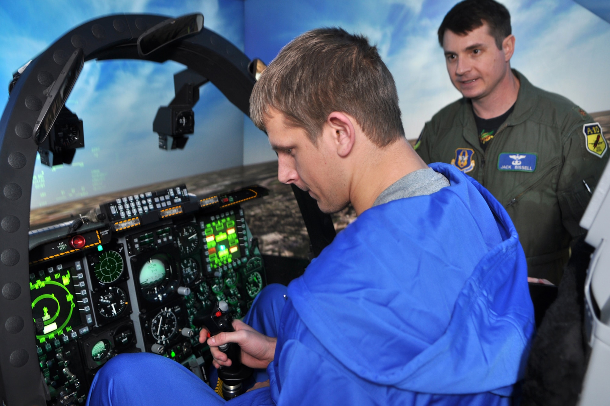 Cadet First Class Kevin Fogler, a senior and receiver for the U.S. Air Force Academy Falcons, tries his hand at the 917th Wing's A-10 simulator at Barksdale Air Force Base, La. Dec. 23, 2010. Cadet Fogler and several other cadets made a visit to the simulator after a luncheon with local civic leaders and servicemembers at the Barksdale Club. The USAFA cadets were in town for the Advocare V 100 Independence Bowl, where they squared off against the Georgia Tech Yellow Jackets. The USAFA Falcons won the contest 14-7. (U.S. Air Force photo/Tech. Sgt. Jeff Walston)   