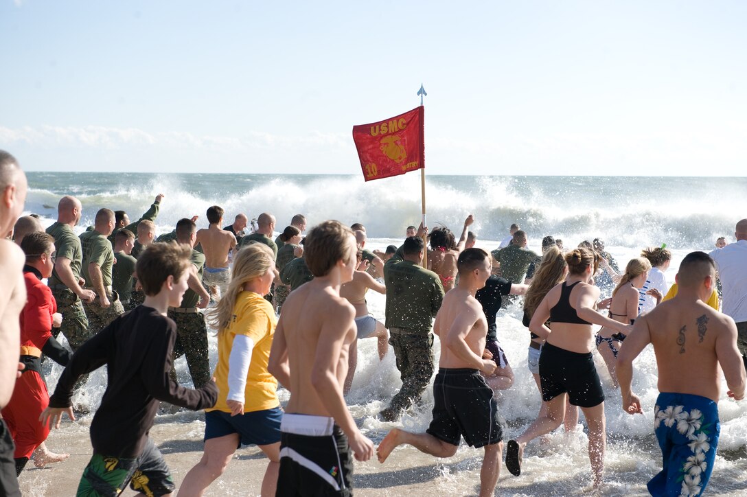 More than 300 people brave the chilly waters during the Polar Plunge at Onslow Beach to raise money for the Onslow County Special Olympics, Saturday, Jan. 8, 2011.