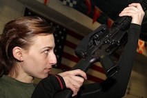 Officer candidate Nicole Gottwaldt, 25, from Ramsey, Minn., performs the inspection arms drill movement during a pool function at the Navy and Marine Corps Reserve Center Jan. 8. Gottwaldt is currently attending St. Catherine University to acquire a degree in communications. For more photos of the event, visit the Recruiting Station Twin Cities fan page at www.facebook.com/rstwincities.