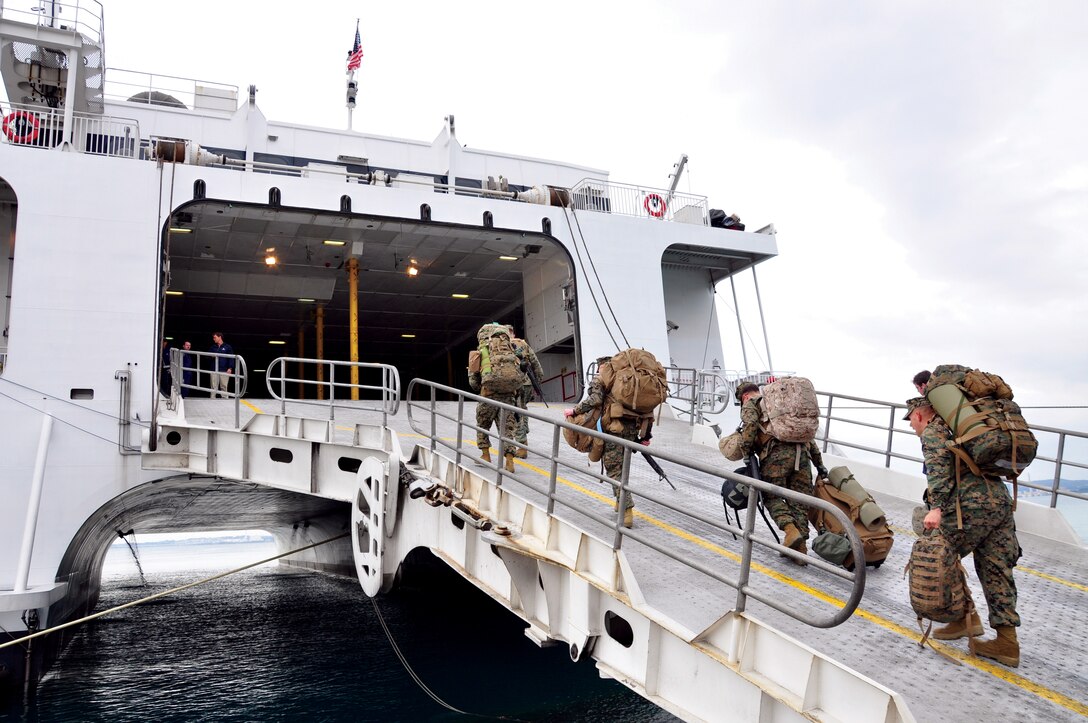 Marines with 3rd Intelligence Battalion, III Marine Expeditionary Force Headquarters Group, III MEF, loaded their personal gear onto the Westpac Express High Speed Vessel to transport them to the Republic of Korea where they participated in Operation Winter Surge 2011 last month. The HSV is a cost-effective mode of transportation which III MEF utilizes to move Marines and equipment to other countries for exercises and operations.