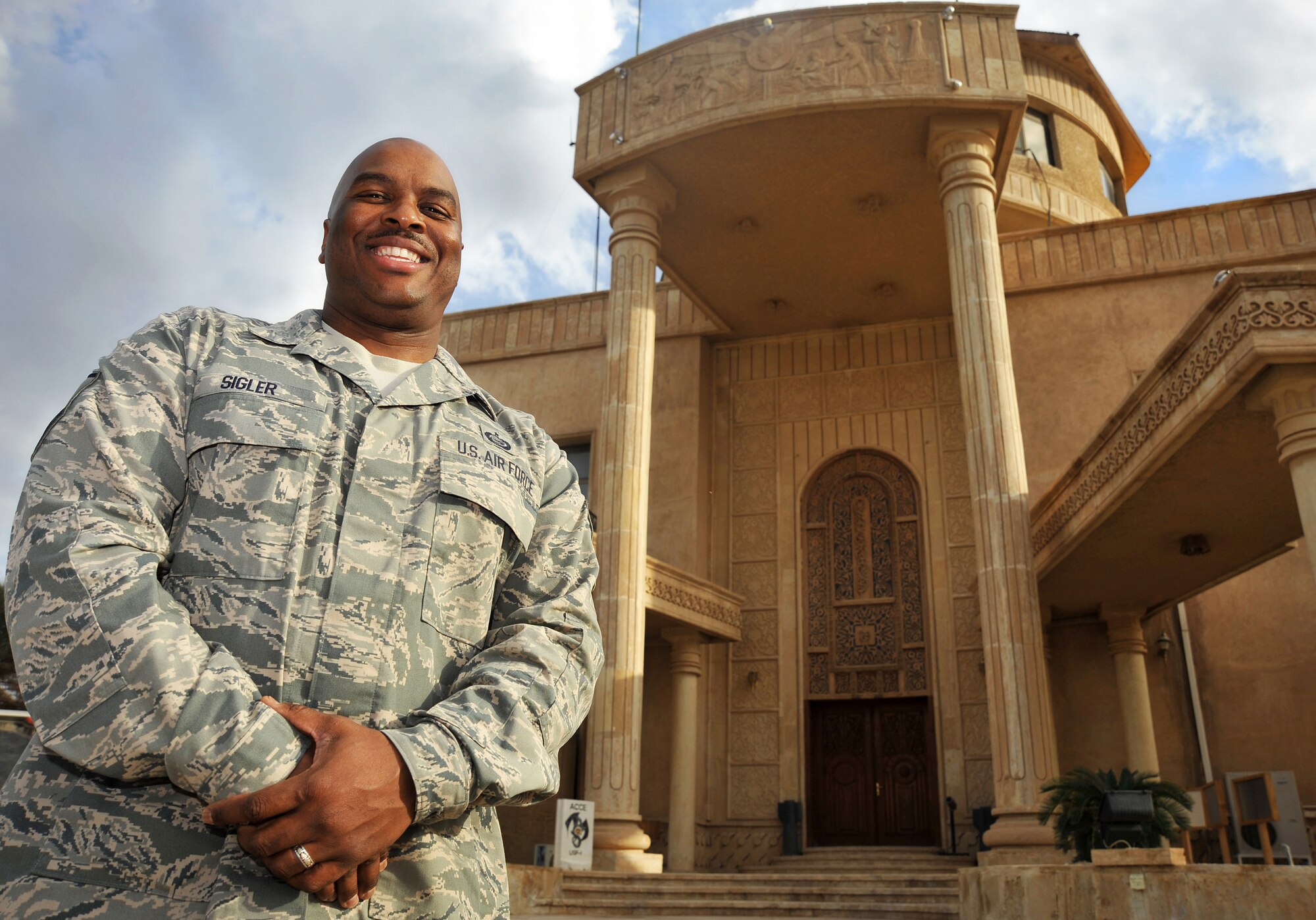 Master Sgt. David Sigler poses for a photo, Jan. 4, in front of the Air Force House on Camp Victory, Iraq. Sergeant Sigler is the non-commissioned officer in charge of the A1 manpower and personnel office. (U.S. Air Force photo by Senior Airman Andrew Lee)