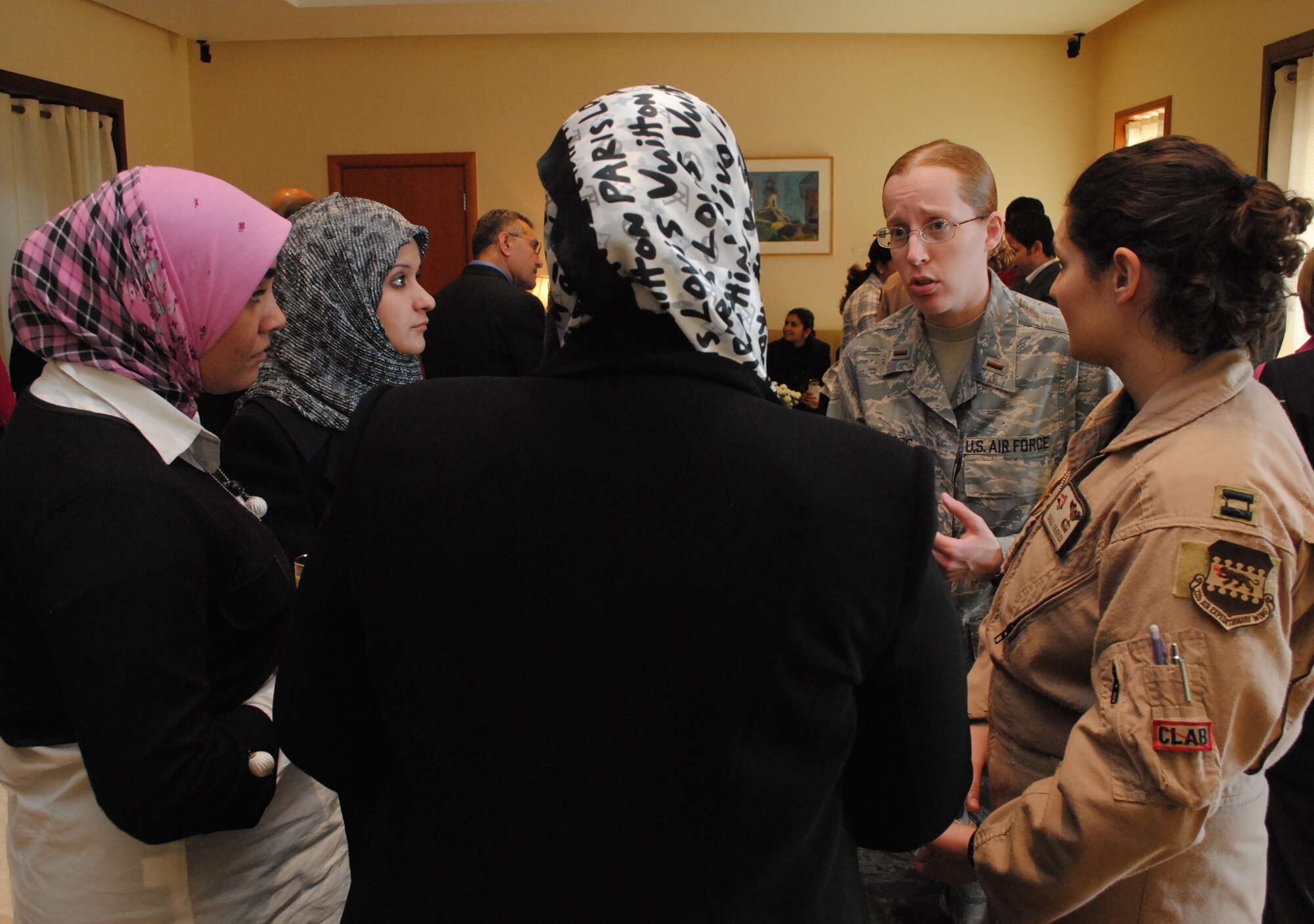 U.S. Air Force 2nd Lt. Lila McClintoc, 332nd Expeditionary Aircraft Maintenance Squadron maintenance officer and Birmingham, Ala., native, talks to several Iraqi women about her experiences in the aviation career field, Jan. 7, during a luncheon at the U.S. Embassy for the Horizon East Women in Aviation, International chapter here in Iraq. The Women in Aviation, International was established to encourage women to seek opportunities in aviation career fields and interests. (U.S. Army photo by SPC Amie J. McMillan)