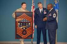 Chief Garry Seay (right) retired in mid-January with more than 30 years of military service. Lt. Col. Bruce Heseltine, 911th Air Refueling Wing commander presented the chief's shadow box, reflective of his long and distinguished career. (USAF photo by Maj. Shannon Mann, 916ARW/PA)