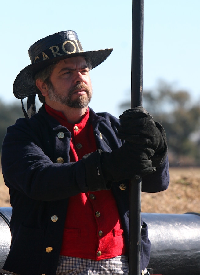 A historical U.S. Army role player stands by a period canon ahead of a demonstration fire. The Jean Lafitte National Historic Park and Preserve hosted a series of living history events on the Chalmette Battlefield in Chalmette, La., Jan. 7-8 in remembrance of the 1815 Battle of New Orleans. (Official Marine Corps photo by Cpl. Jad Sleiman)