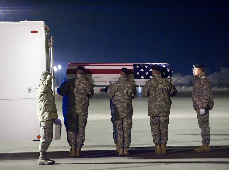 A U.S. Army carry team transfers the remains of Army Spc. Ethan C. Hardin of Fayetteville, Ark., at Dover Air Force Base, Del., Jan. 9, 2011.  Hardin was assigned to the 2nd Battalion, 30th Infantry Regiment, 4th Brigade Combat Team, 10th Mountain Division, Fort Polk, La.  (U.S. Air Force photo/Jason Minto)