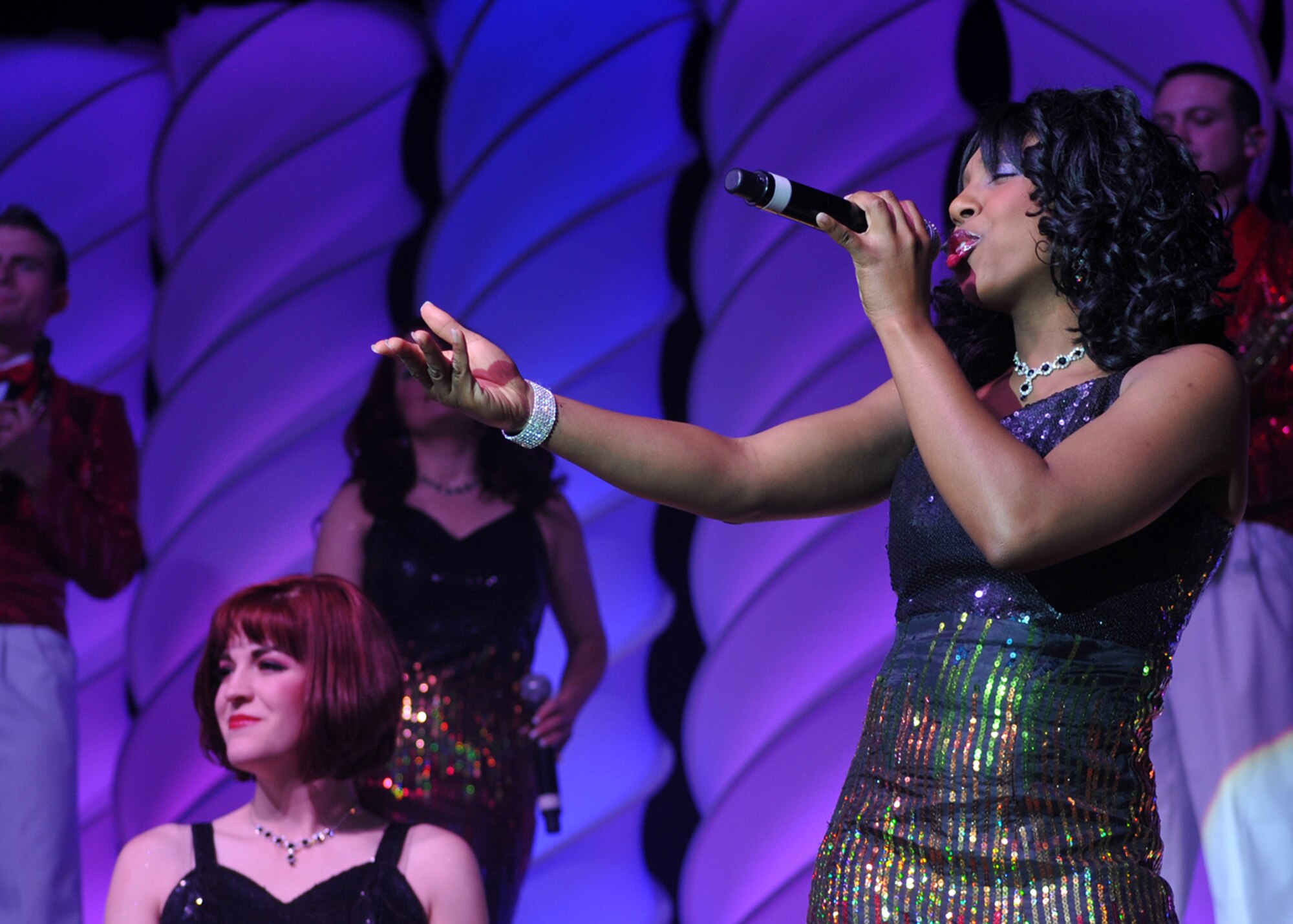 Members of Tops in Blue perform at Osan Air Base Jan. 9. The Tops in Blue 2010 World Tour "We Believe" is a salute to the ideals we believe in as Americans. The show featured rhythm and blues music, and renditions of songs from artists including Michael Buble, Lady Gaga and the Black Eyed Peas. (U.S. Air Force photo/Senior Airman Evelyn Chavez)