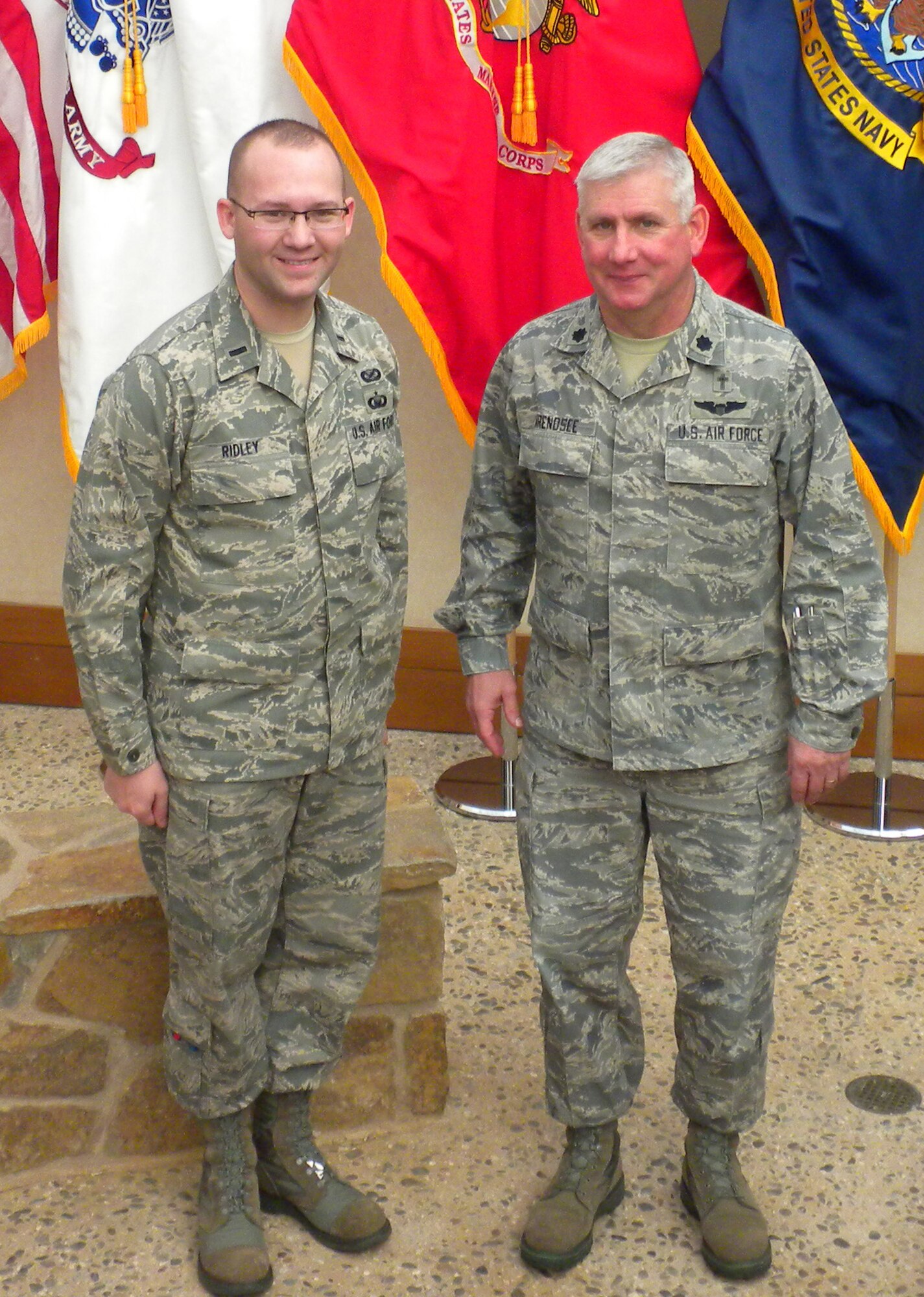 Ch. (Lt. Col.) Douglas Arendsee and 1st Lt. Rusty Ridley of the Wyoming Air National Guard work togther at Air Force Mortuary Affairs Operations nearly nine years after Arendsee enlisted Ridley in the 153rd Airlfit Wing as a chaplain assistant.