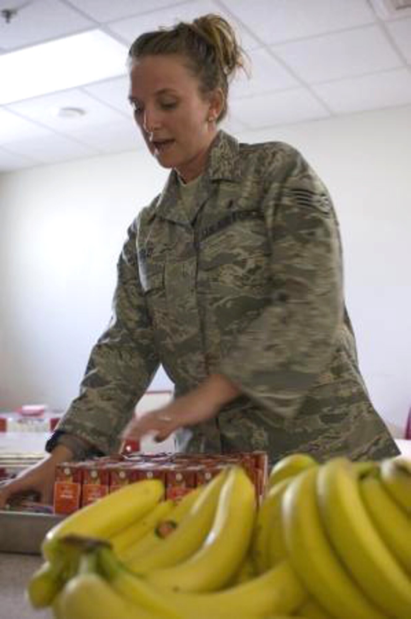 BAGRAM AIR FIELD, AFGHANISTAN - Diet technicians like Staff Sgt. Tiffany Arnold, help Airmen develop healthy eating habits like eating daily recommended amounts from each food group, as part of their diets. Staff Sgt. Casey Muilenburg and Senior Airman Jennifer White with the 446th Aeromedical Staging Squadron, Joint Base Lewis-McChord, McChord Field, Wash., run nutrition and weight management classes specifically catering to Reservists. The diet technicians teach Reservists how to choose foods that give them the most energy, prepare better serving sizes and practise portion control. (Photo Courtesy/Staff Sgt. Rachel Martinez)


