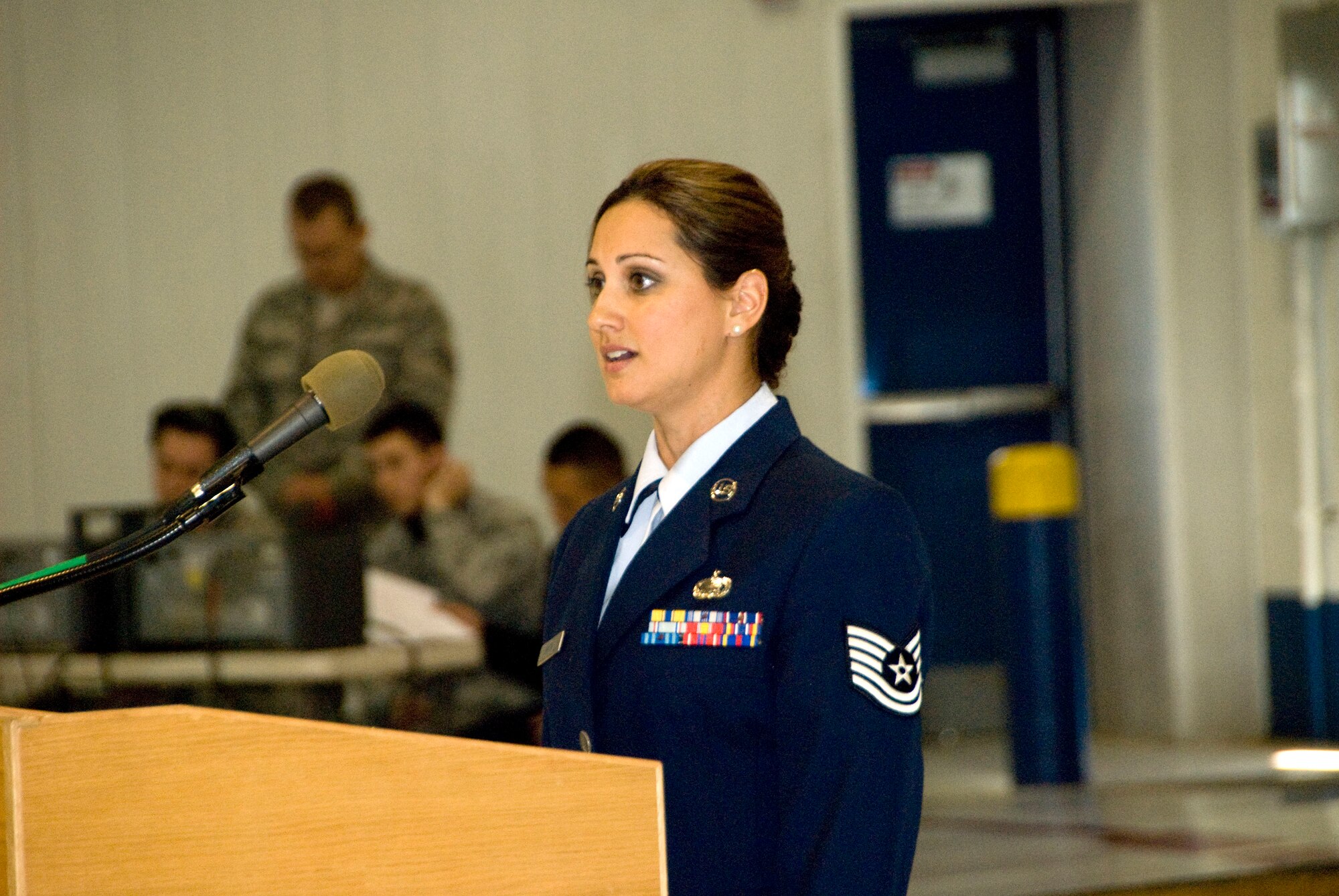 Tech. Sgt. Chandra Smith sing’s ‘Amazing Grace’ at the 162nd Fighter Wing’s assumption of command ceremony in honor of the victims involved in the Jan. 8 shooting in Tucson, Ariz. (U.S. Air Force photo/Master Sgt. Dave Neve)
